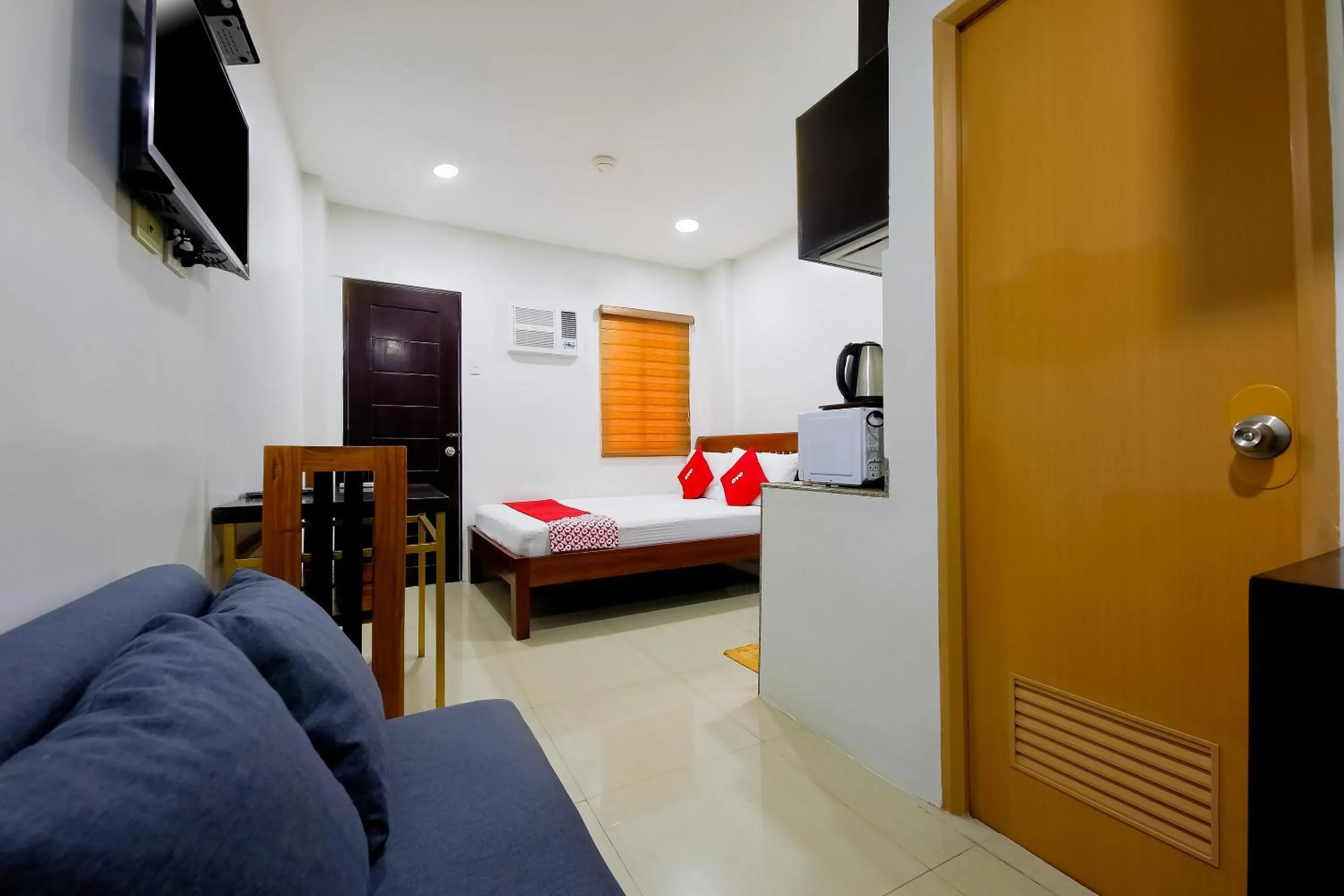 Bedroom in OYO 848 Dona Aurora Condotel