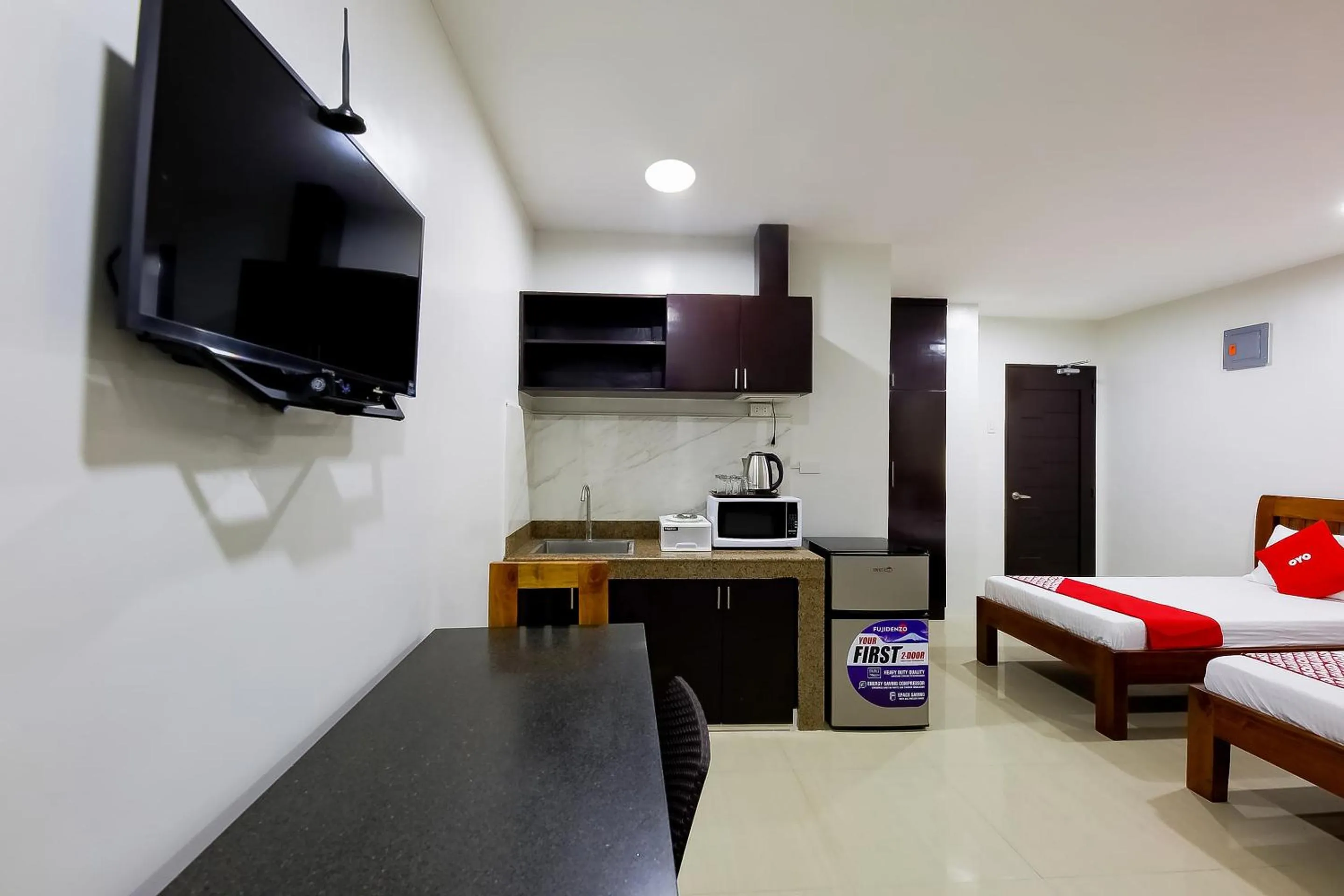 Bedroom in OYO 848 Dona Aurora Condotel