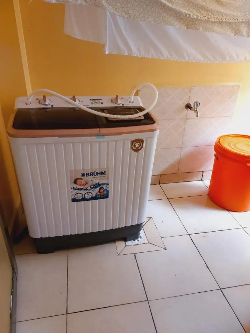 washing machine in Lux Suites Honey Dew Stays Athiriver