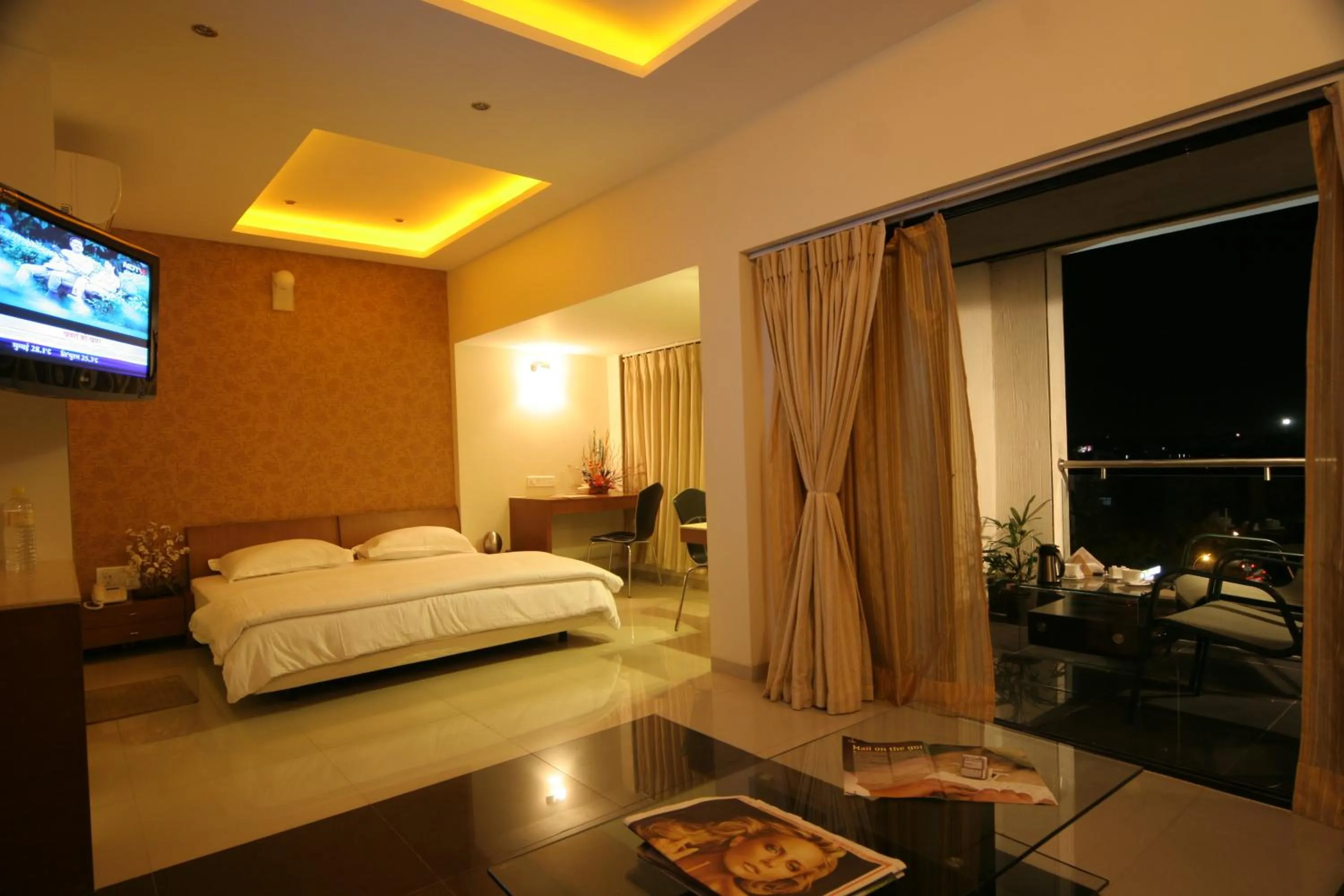 Photo of the whole room, Bed in Pride Biznotel Alkapuri Near Vadodara Airport