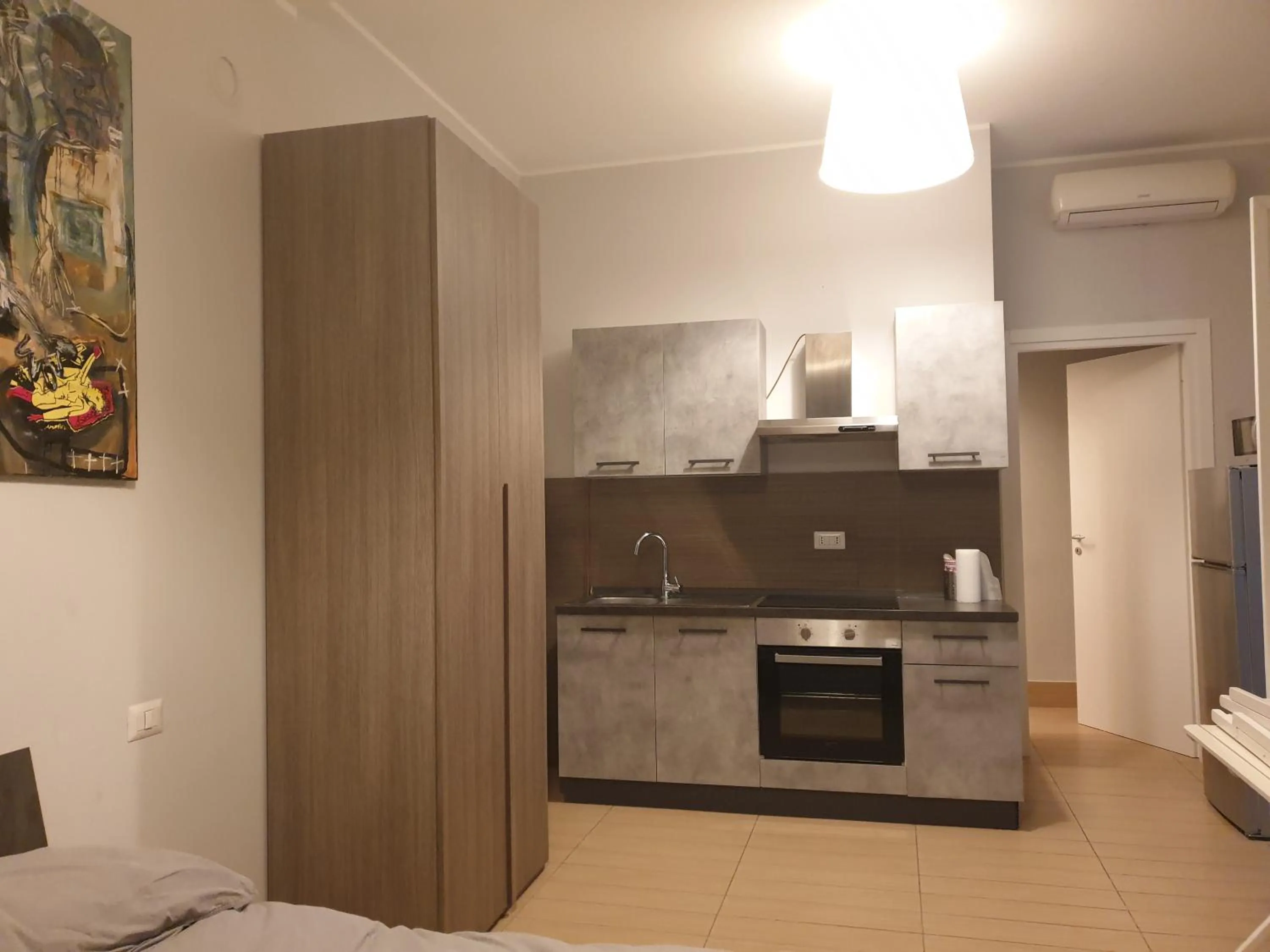 Kitchen or kitchenette in Michelangelo Apartments con parcheggio gratuito in loco e self check in