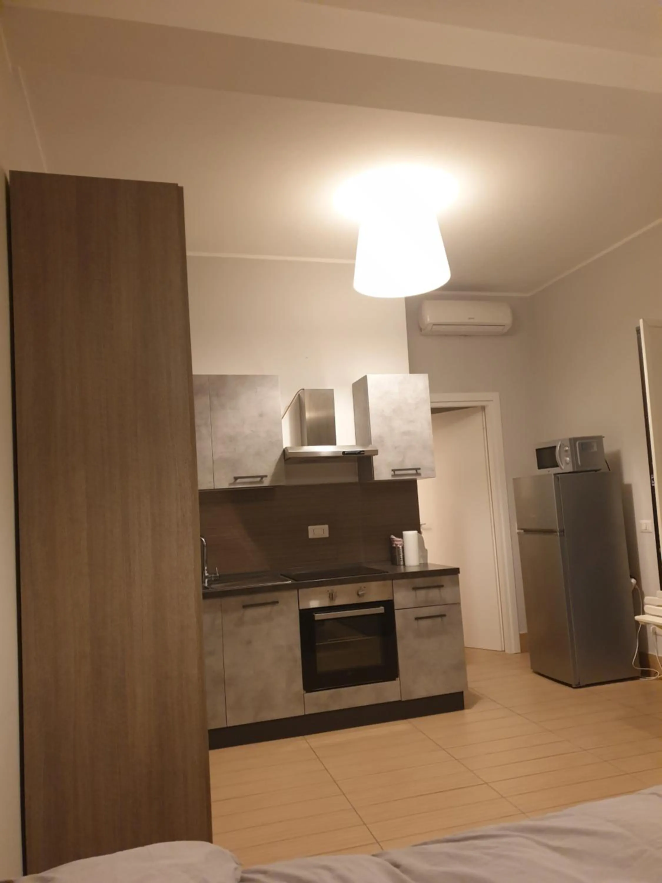 Kitchen or kitchenette in Michelangelo Apartments con parcheggio gratuito in loco e self check in