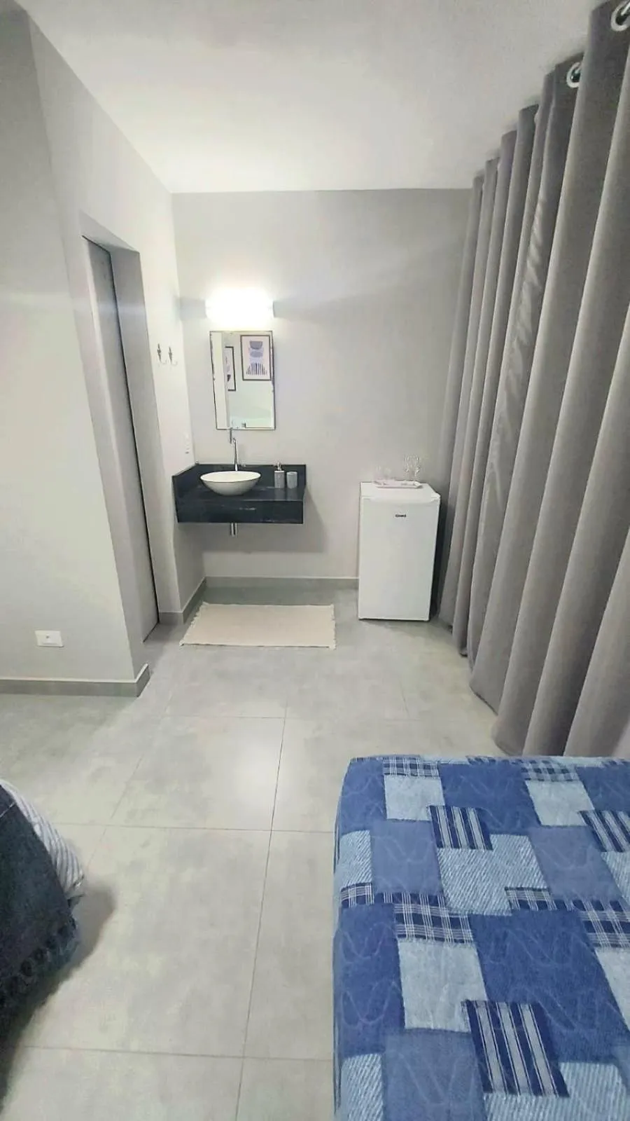 Photo of the whole room in Suíte Ilhinha em condomínio na Praia do Perequê