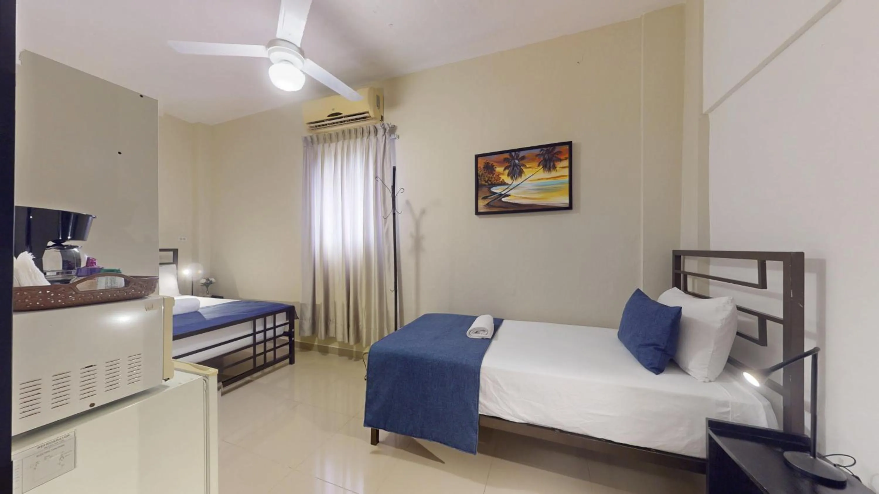 Bed in Hotel Tau Art Residence