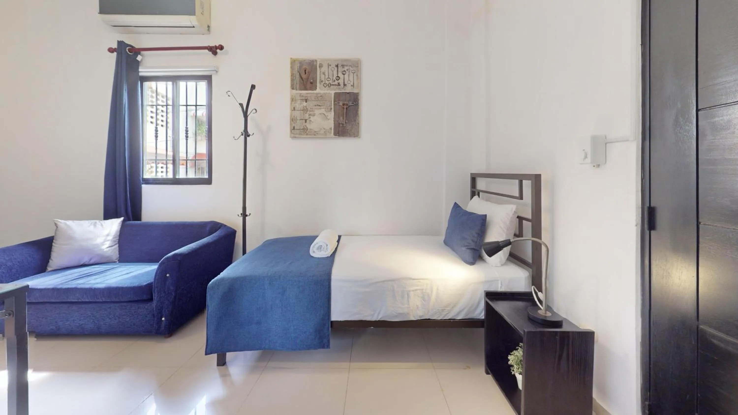 Bed in Hotel Tau Art Residence