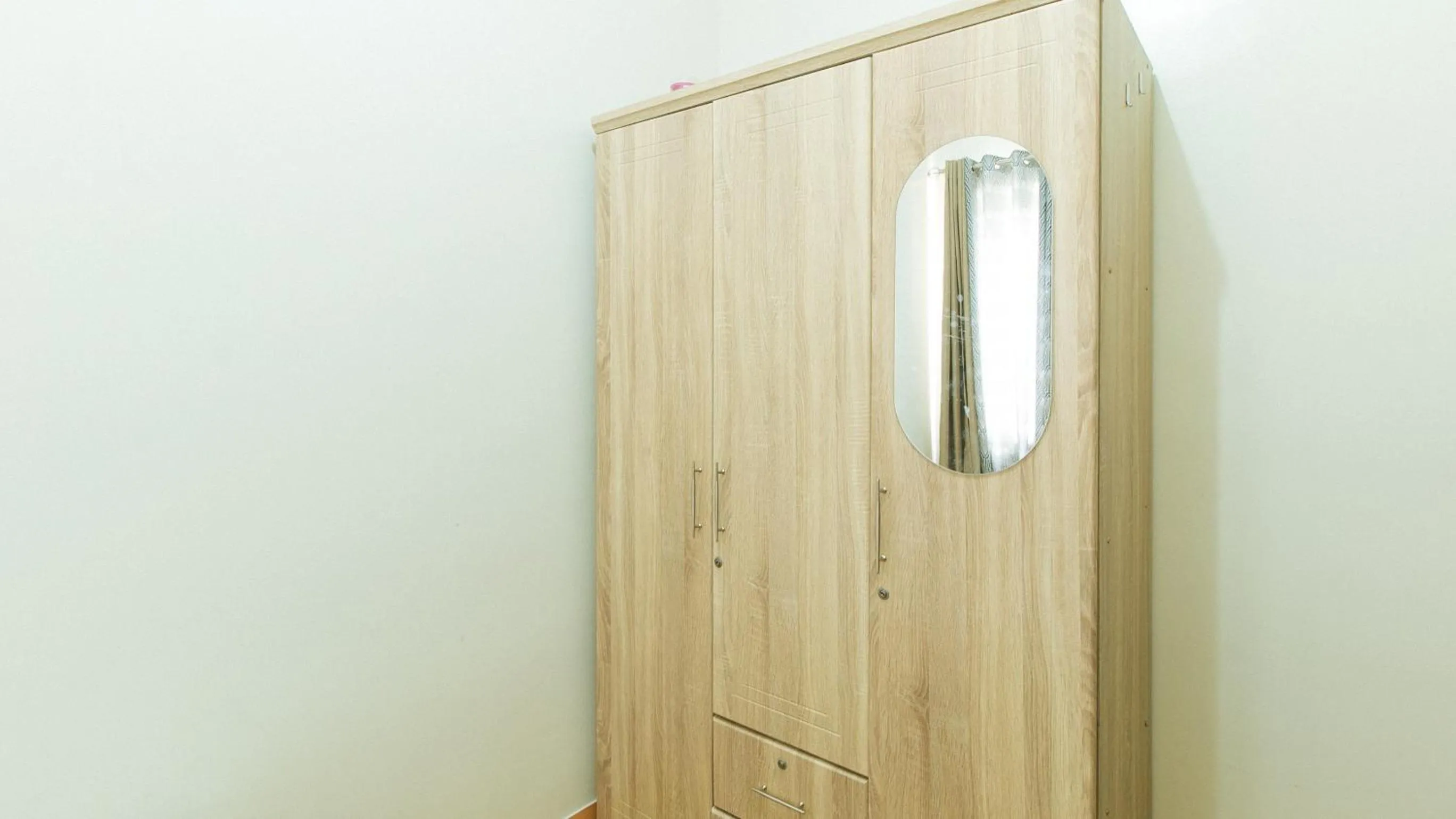 wardrobe in Jamah's Staycation at SMDC Trees Residences by RedDoorz