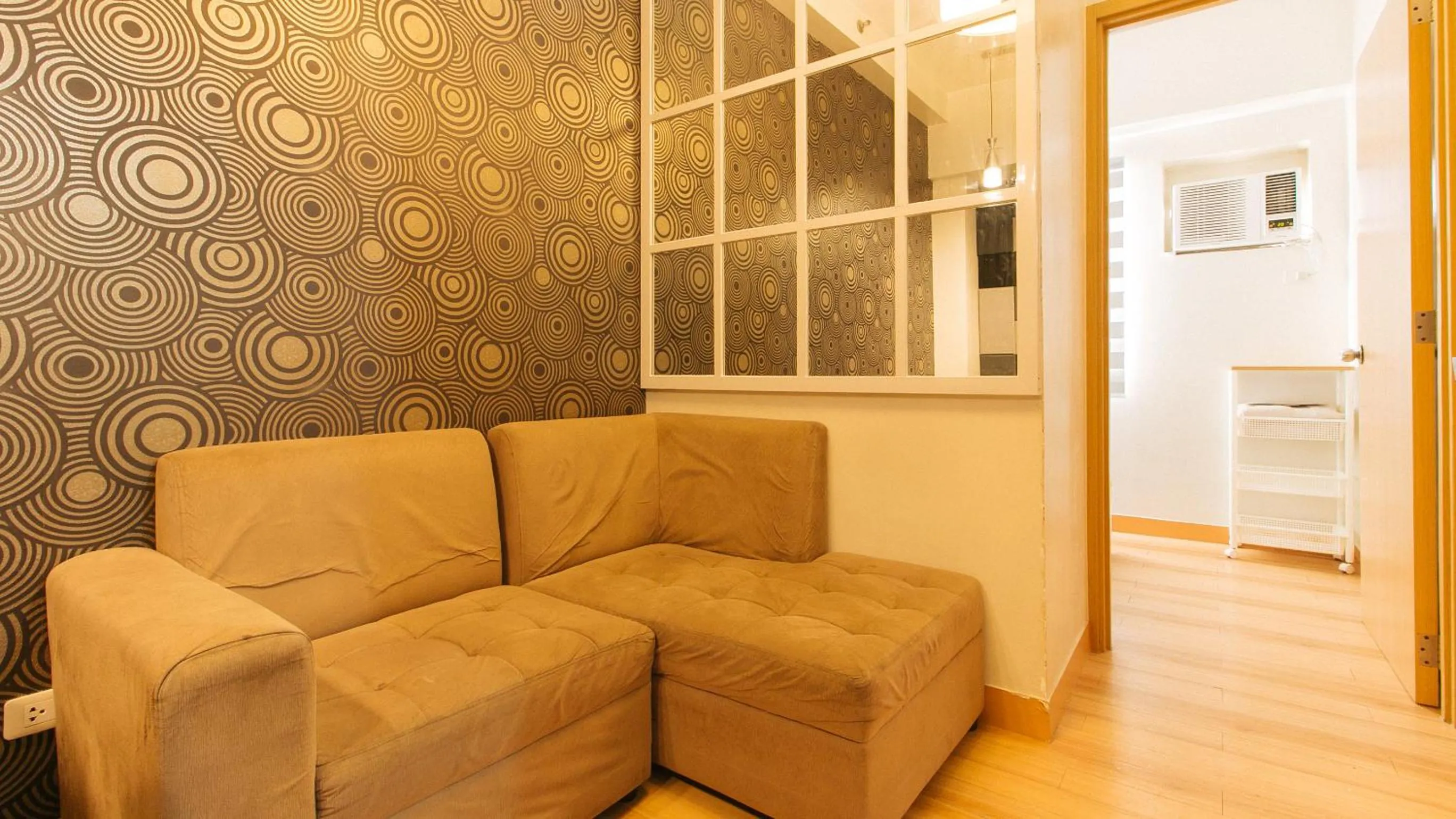 Seating area in Jamah's Staycation at SMDC Trees Residences by RedDoorz