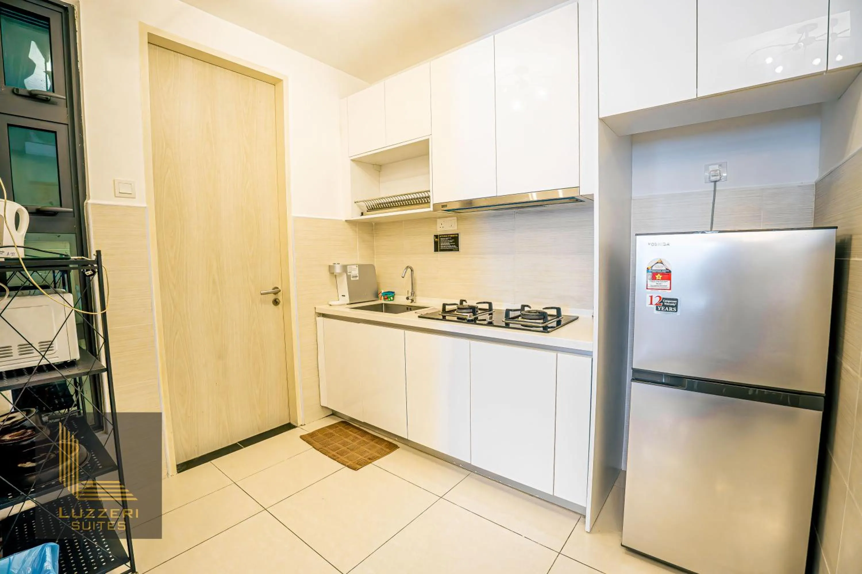kitchen in Legasi Kampung Baru Guesthouse