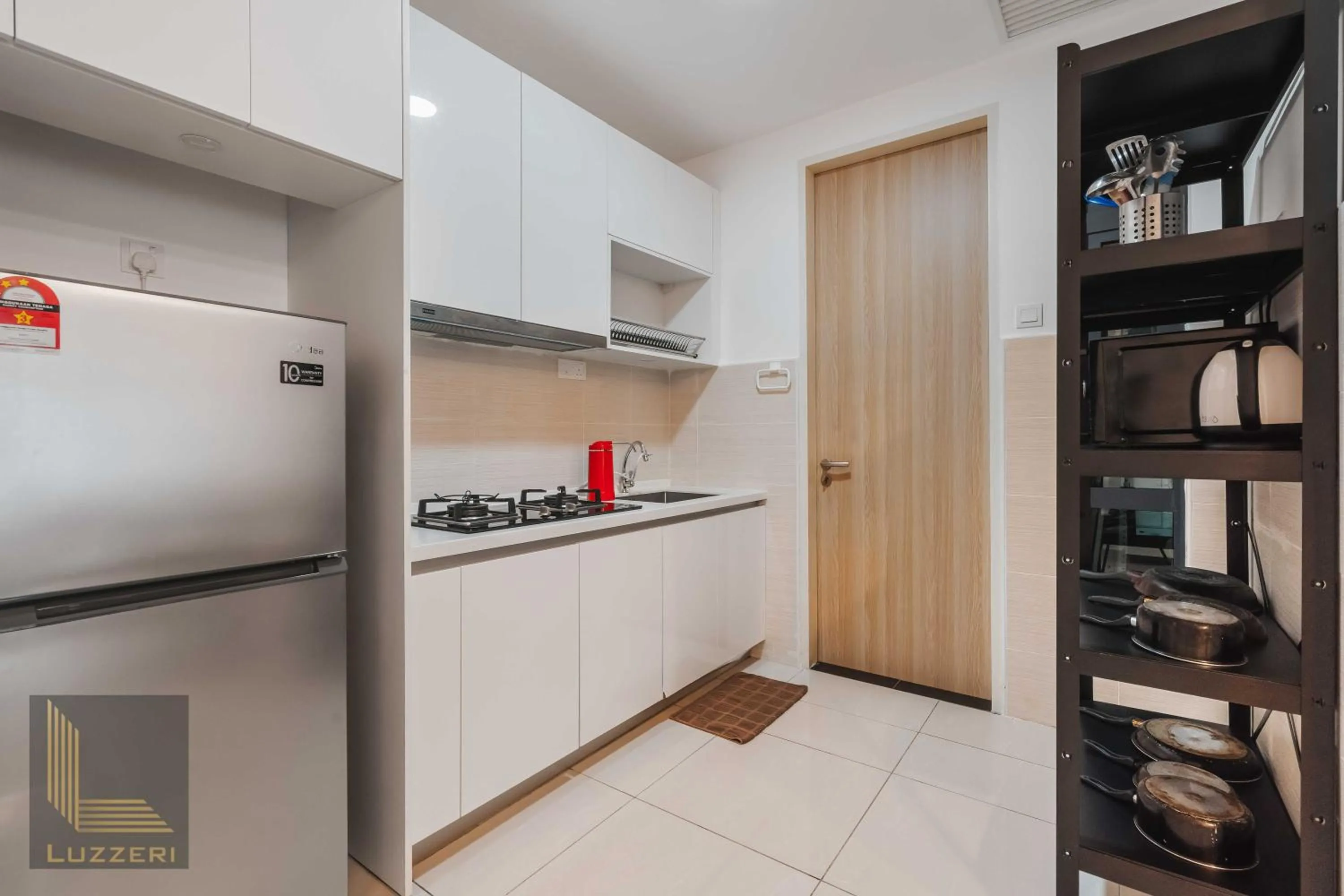 stove in Legasi Kampung Baru Guesthouse