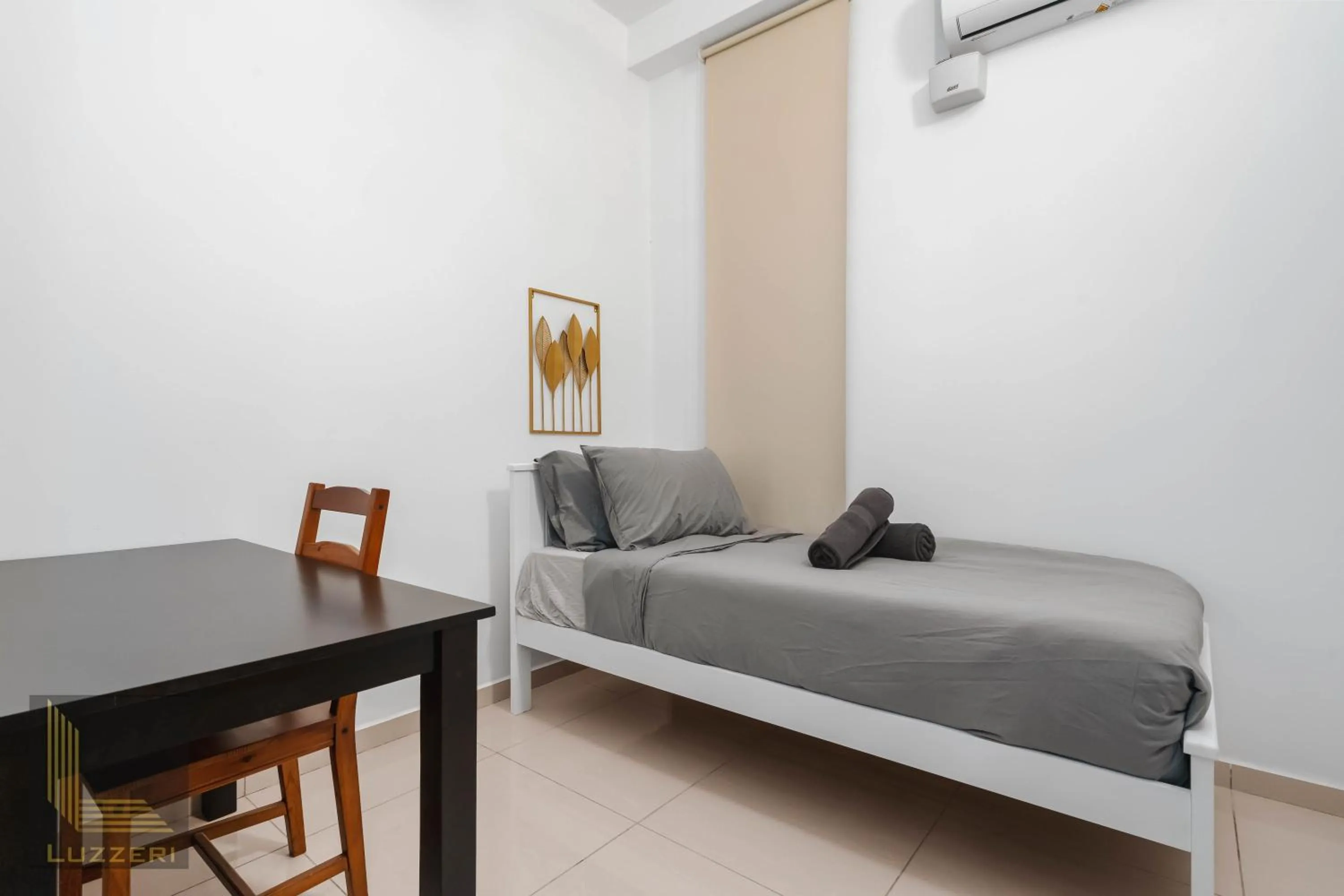 Bed in Legasi Kampung Baru Guesthouse