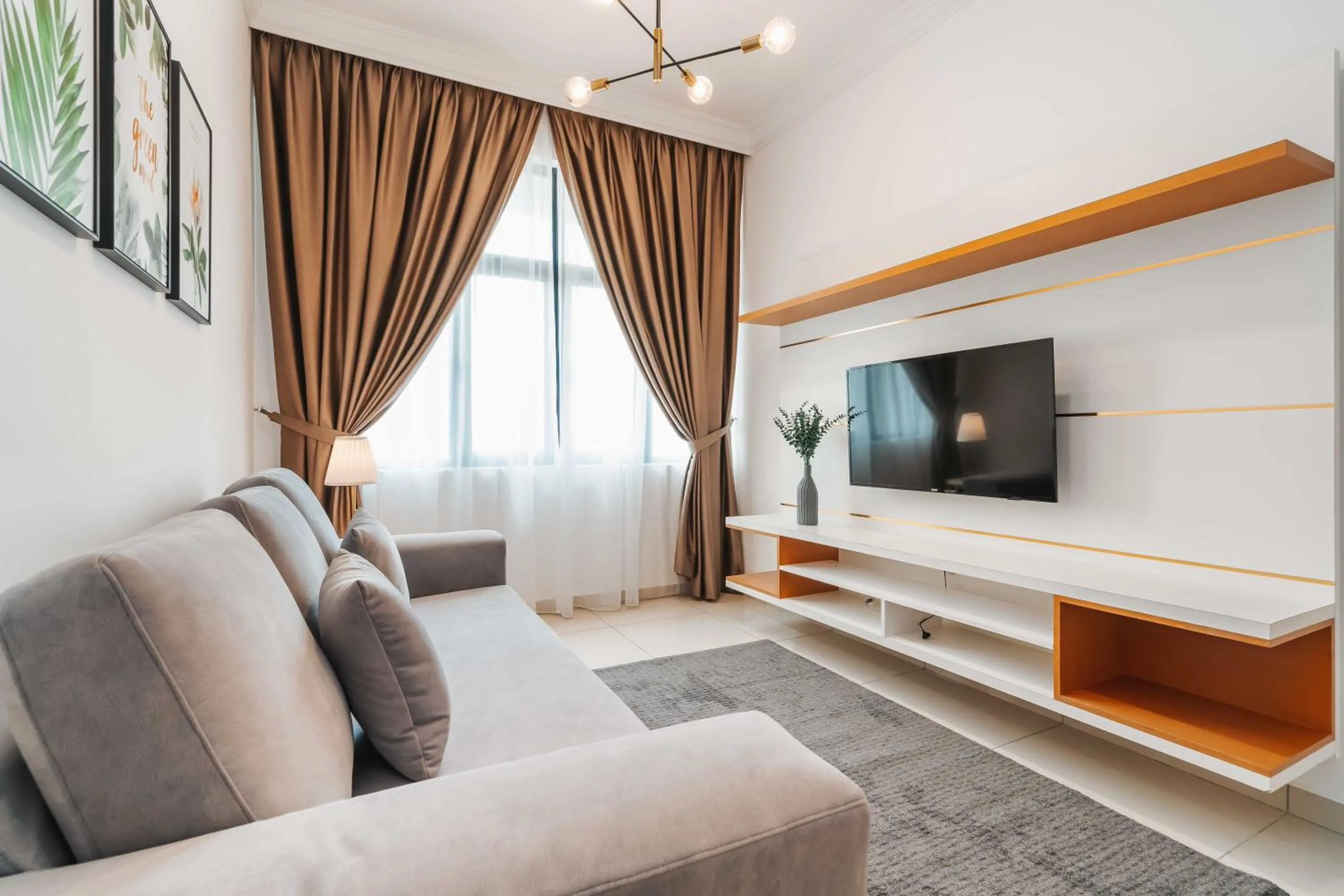 Communal lounge/ TV room in Legasi Kampung Baru Guesthouse