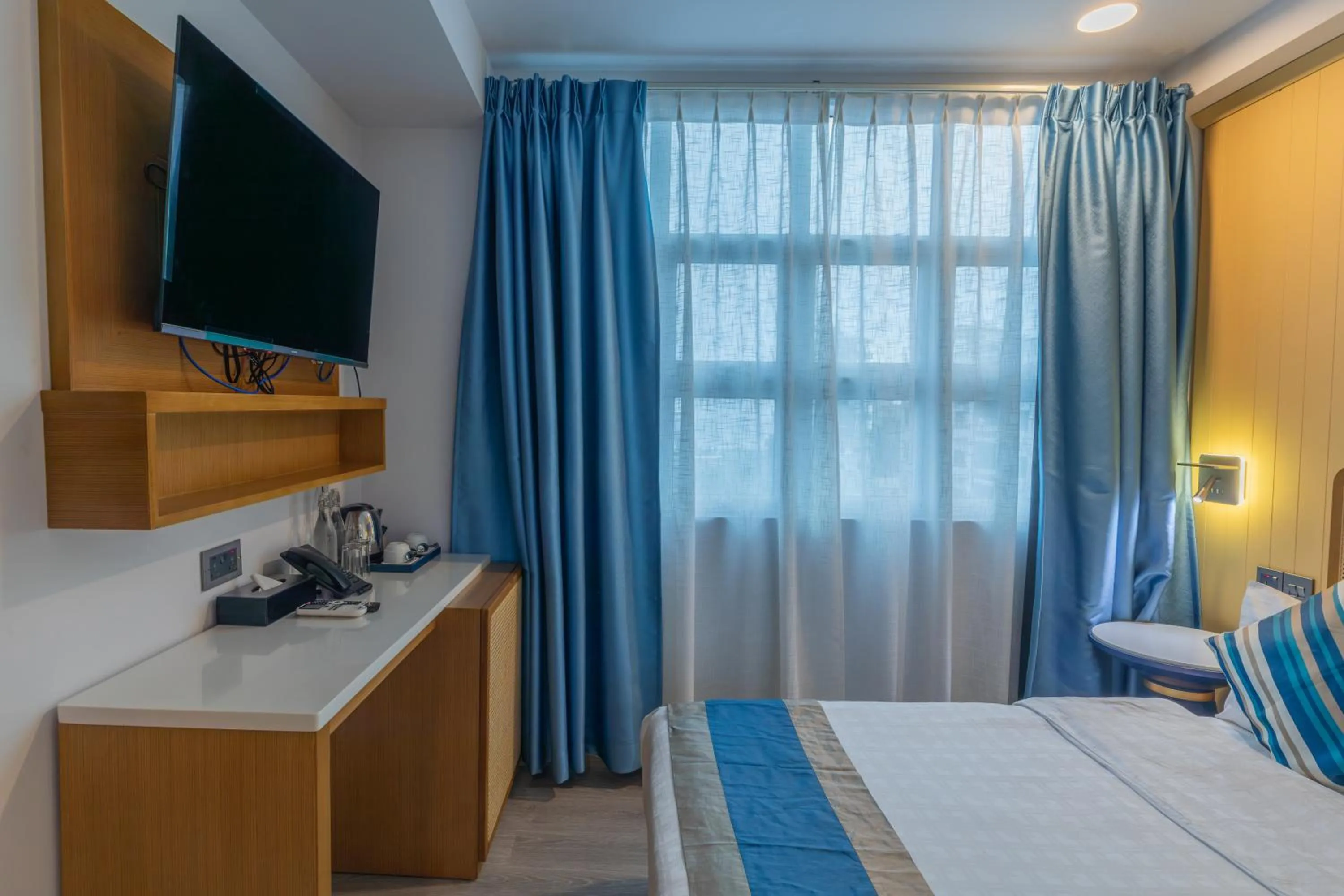 Bedroom, Bed in UMET Seaview Hotel with Free Airport Pick up and Drop T&C Apply