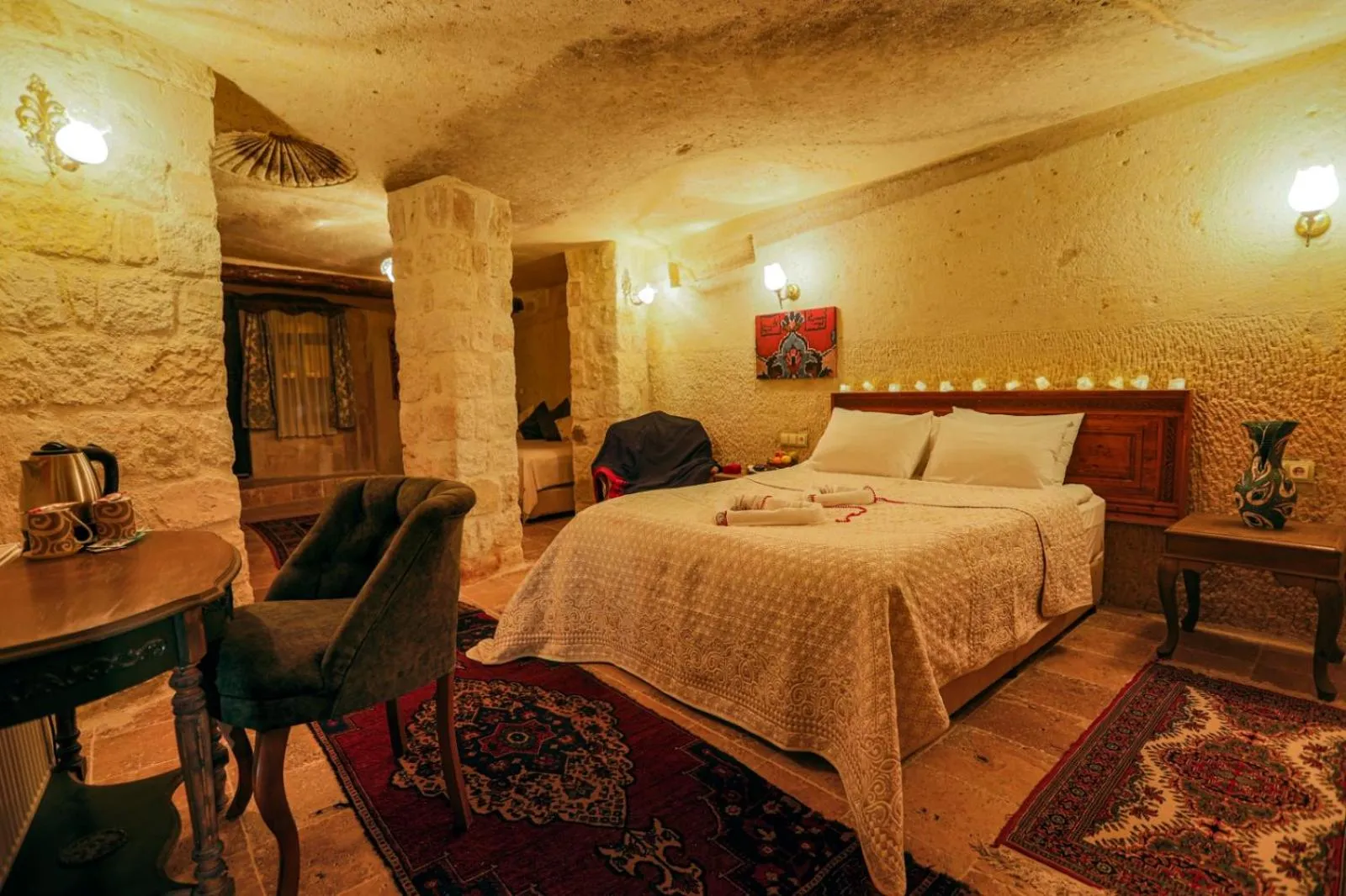 Photo of the whole room, Bed in Sinasos Palace Cave Hotel
