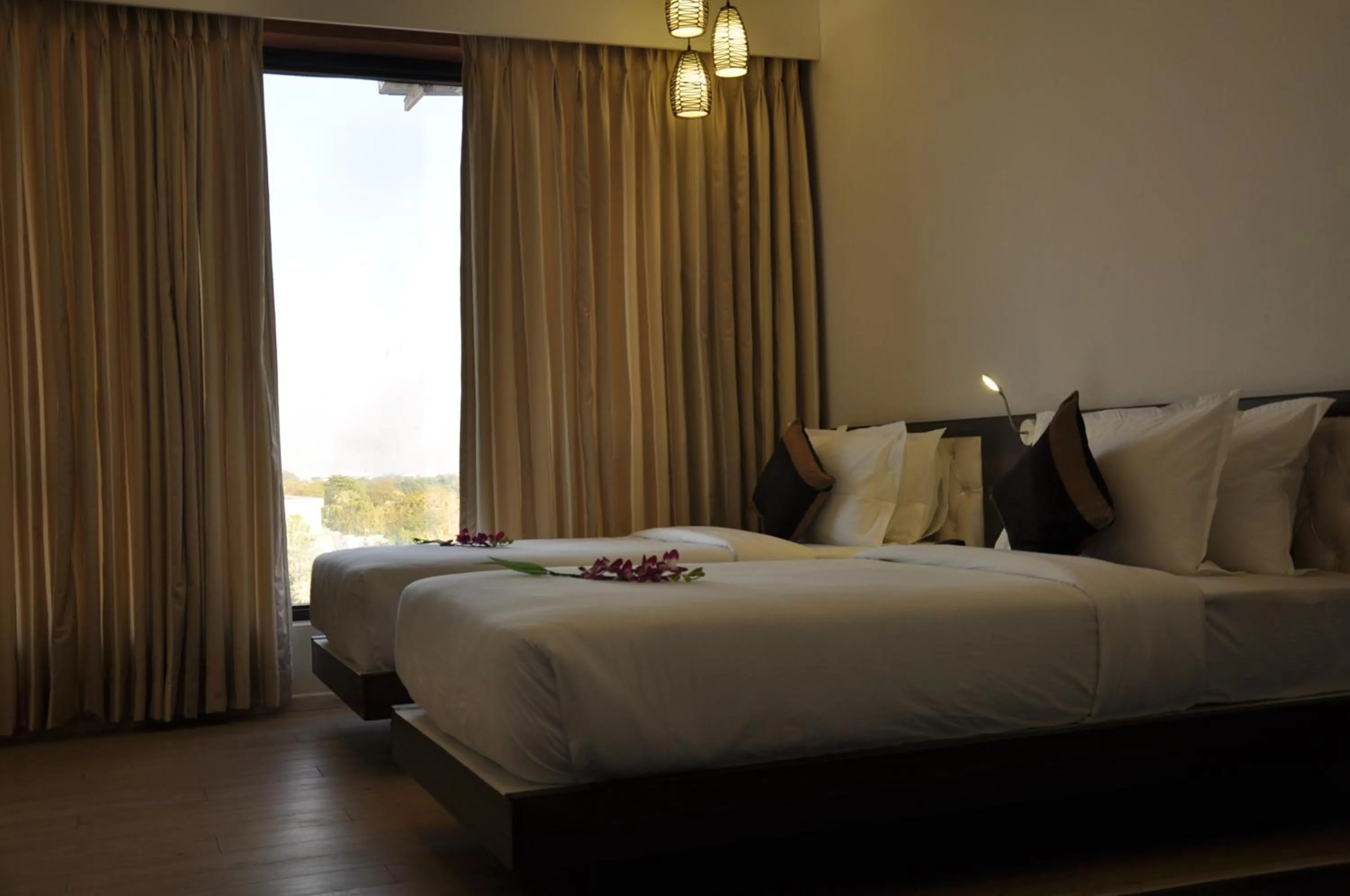Photo of the whole room, Bed in Pride Biznotel Manjusar Vadodara Near Sokhda Lake
