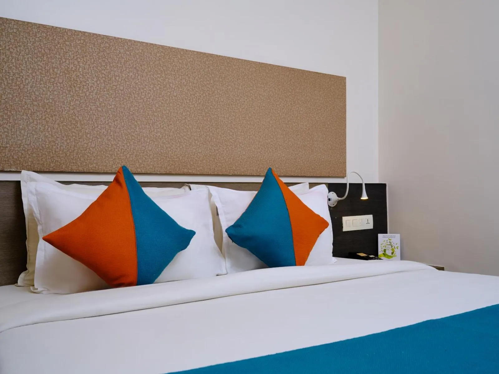 Bed in Pride Biznotel Manjusar Vadodara Near Sokhda Lake