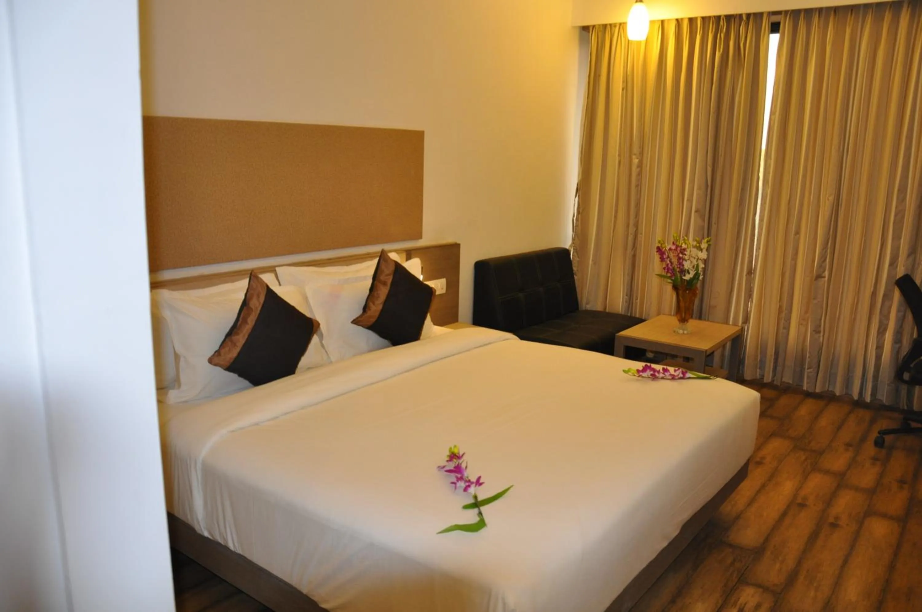 Photo of the whole room, Bed in Pride Biznotel Manjusar Vadodara Near Sokhda Lake