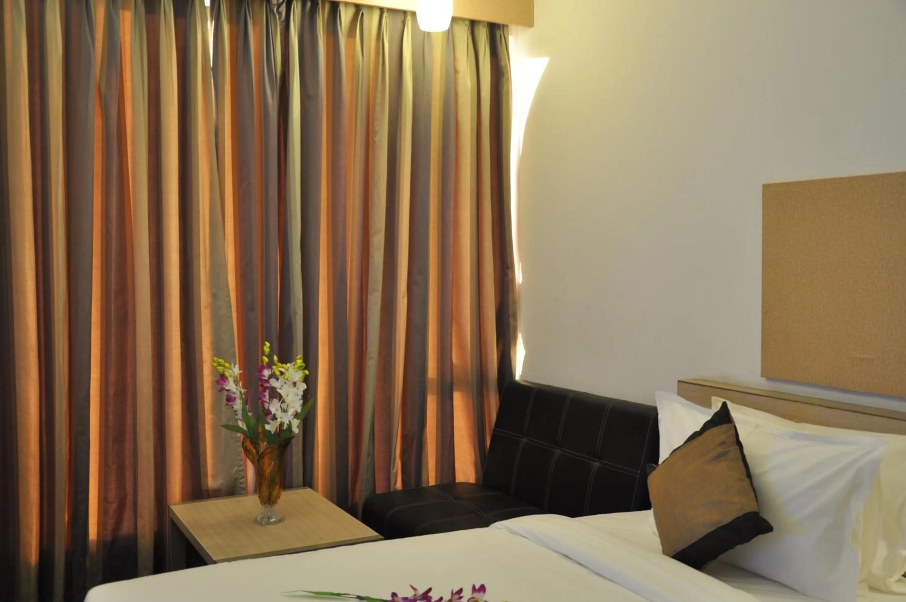 Bed in Pride Biznotel Manjusar Vadodara Near Sokhda Lake