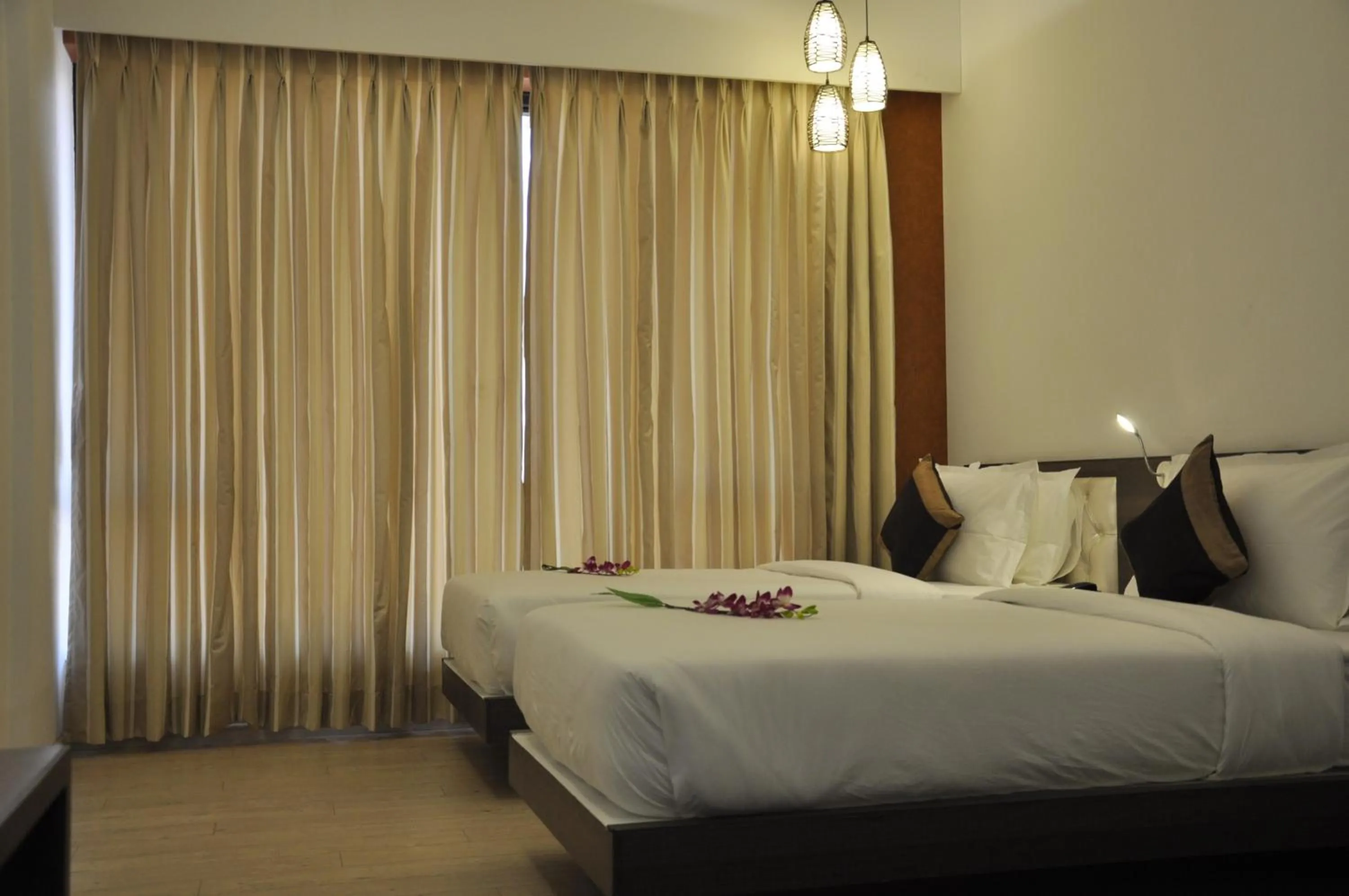Bed in Pride Biznotel Manjusar Vadodara Near Sokhda Lake