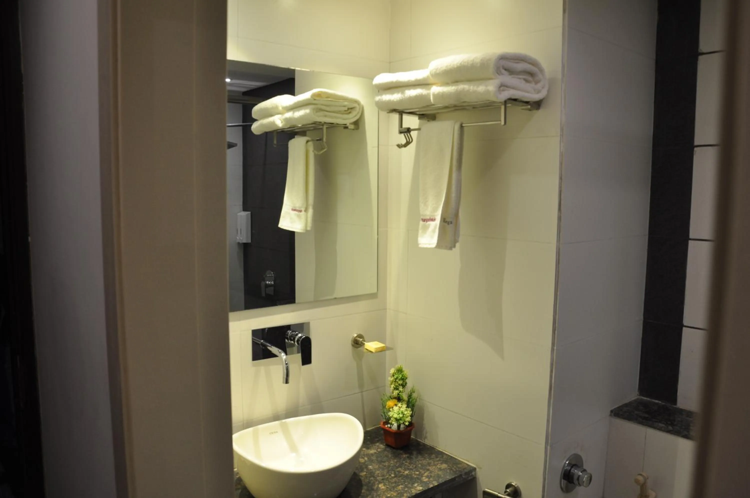 Bathroom in Pride Biznotel Manjusar Vadodara Near Sokhda Lake