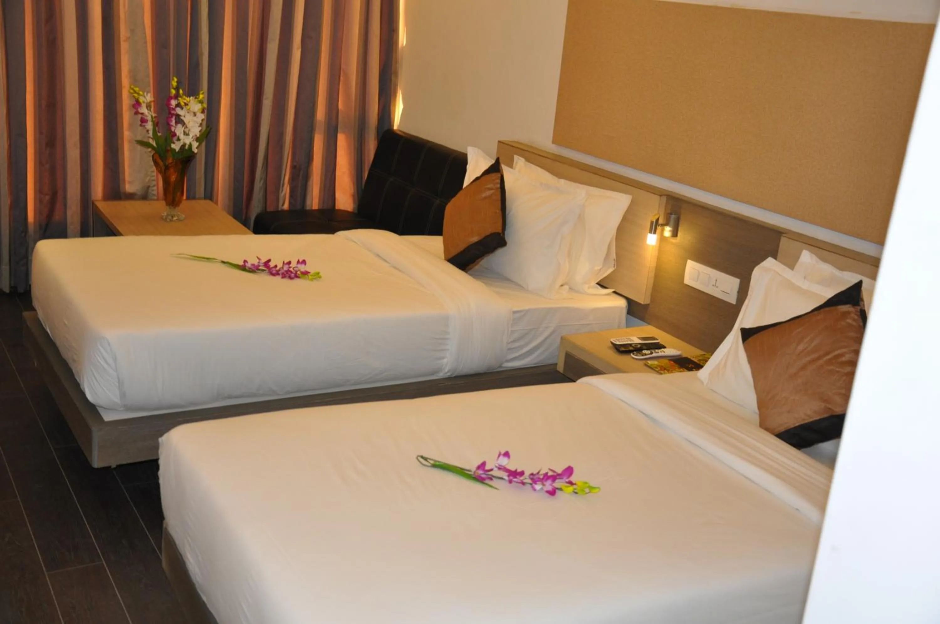 Bed in Pride Biznotel Manjusar Vadodara Near Sokhda Lake