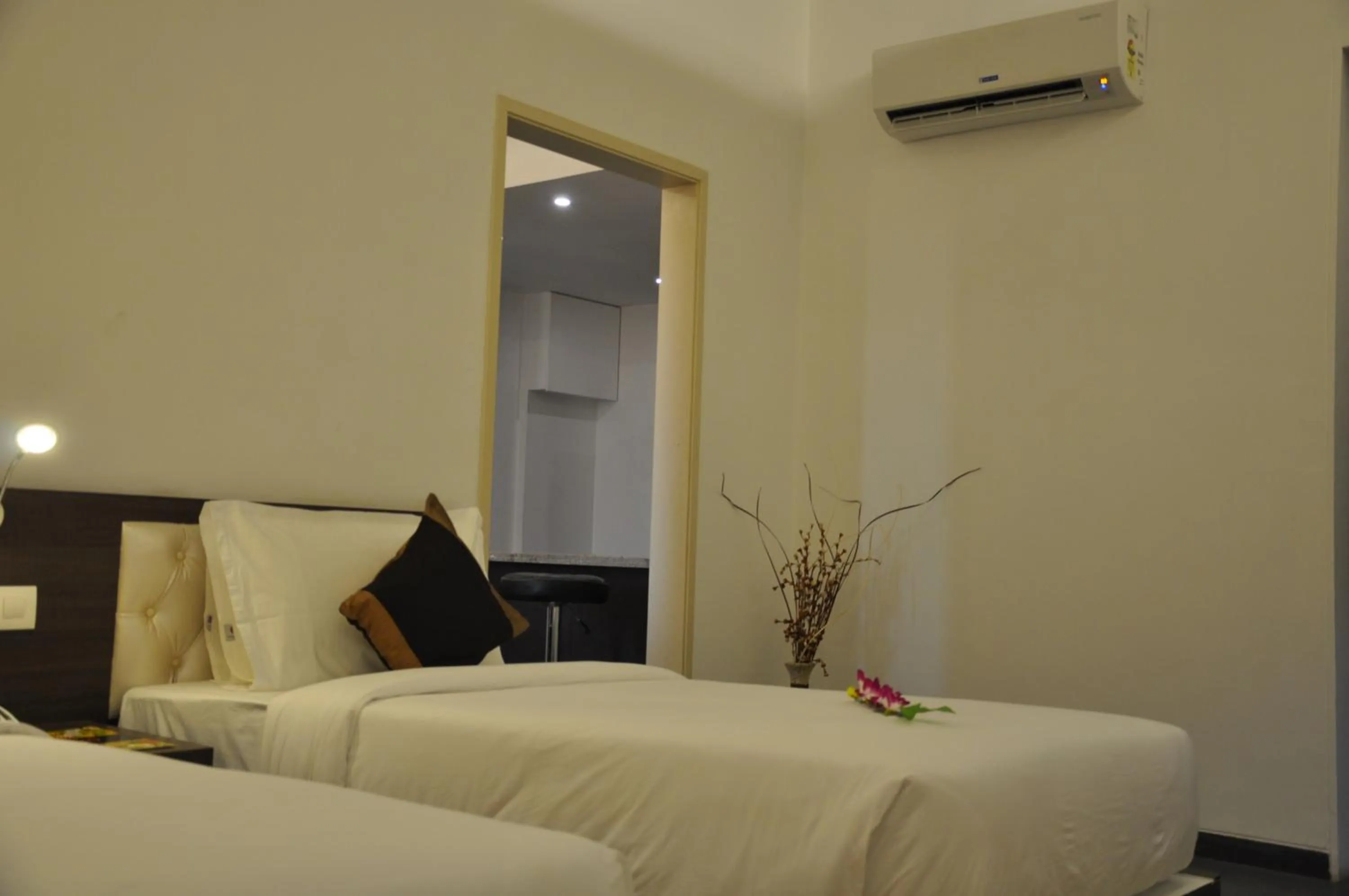 Bed in Pride Biznotel Manjusar Vadodara Near Sokhda Lake