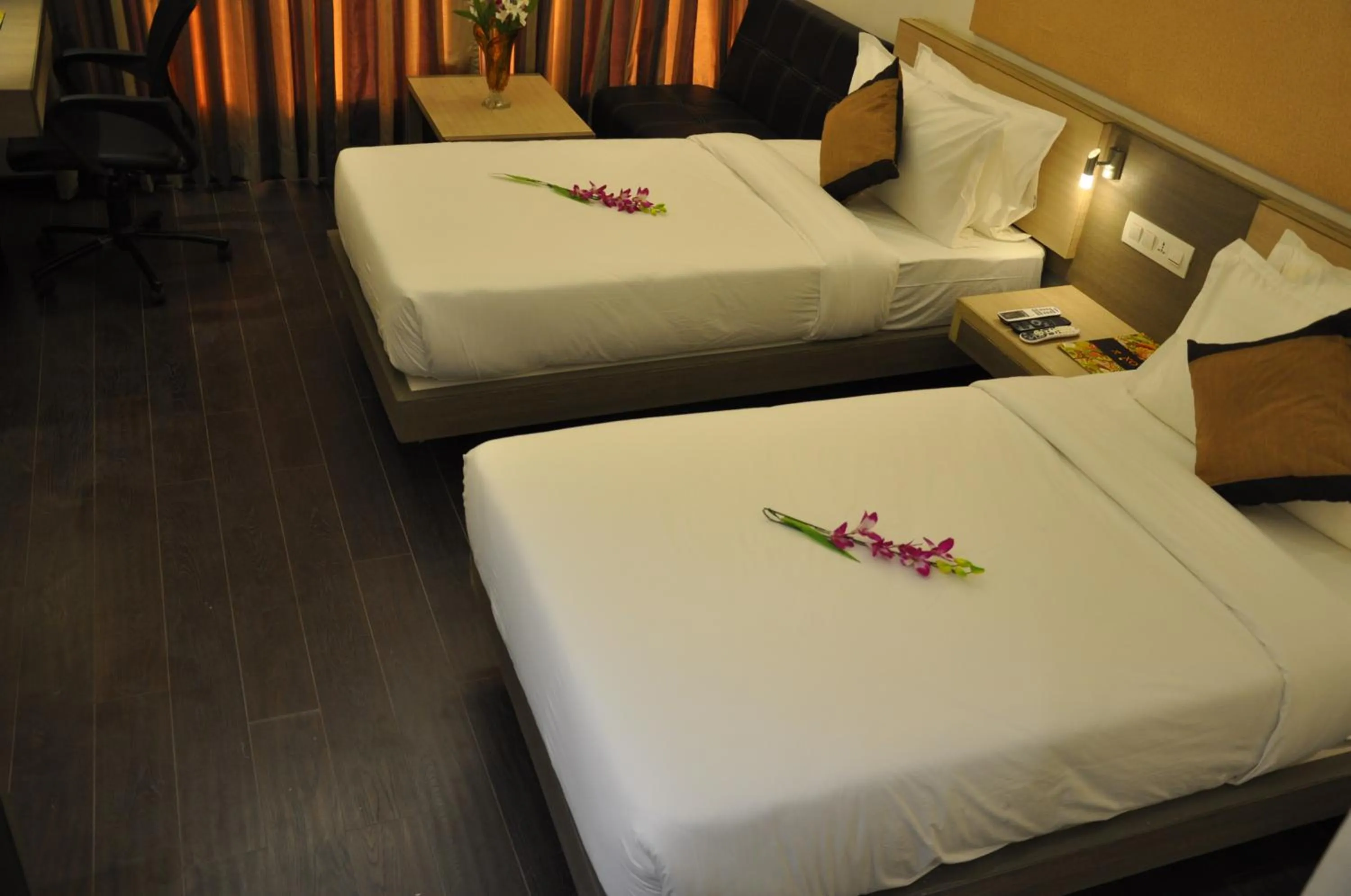 Bed in Pride Biznotel Manjusar Vadodara Near Sokhda Lake