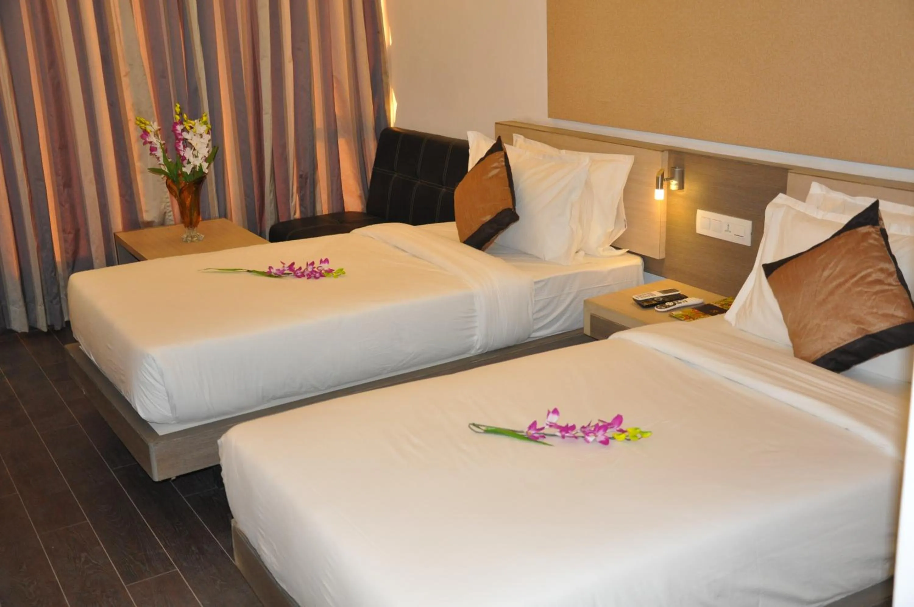 Photo of the whole room, Bed in Pride Biznotel Manjusar Vadodara Near Sokhda Lake