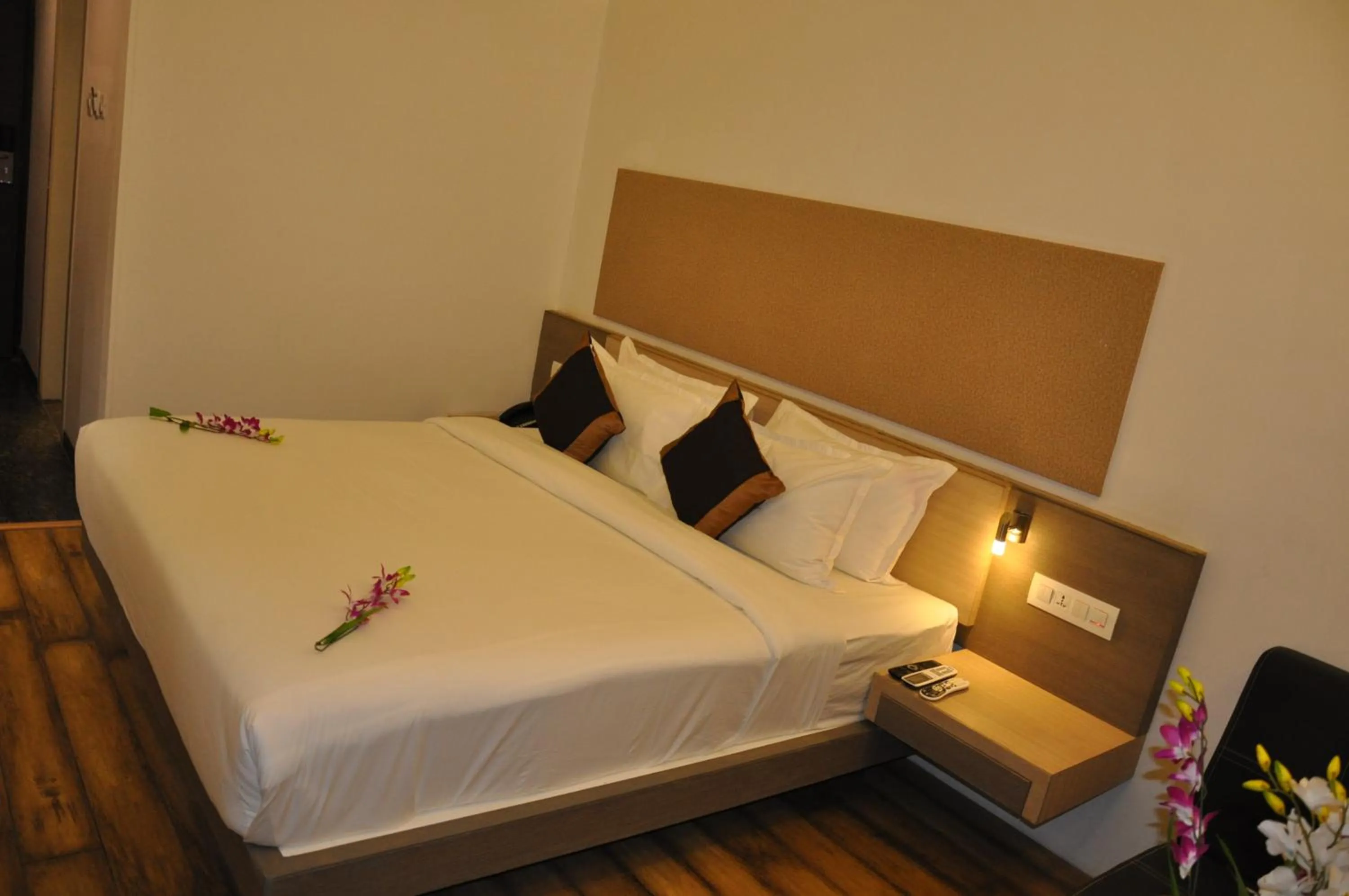 Bed in Pride Biznotel Manjusar Vadodara Near Sokhda Lake