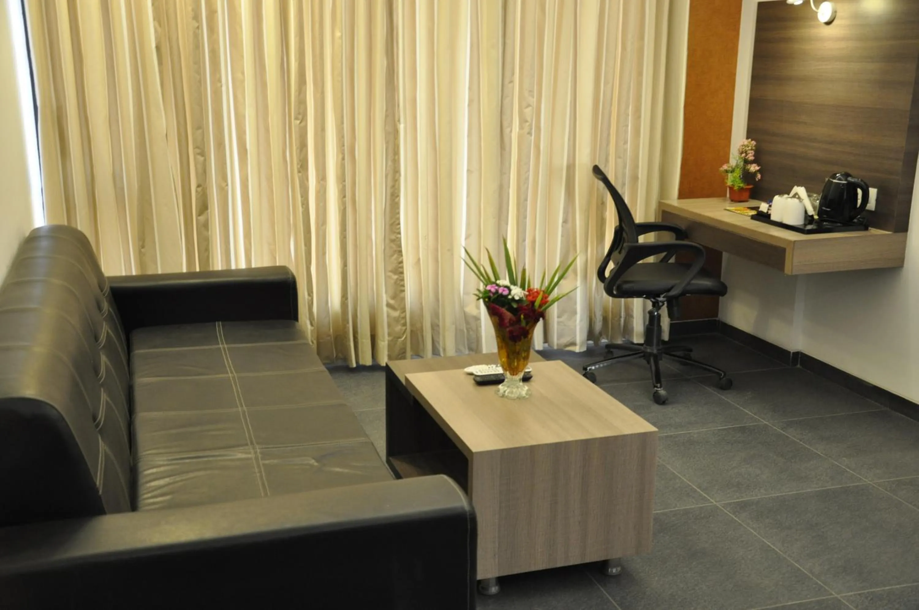 Living room in Pride Biznotel Manjusar Vadodara Near Sokhda Lake