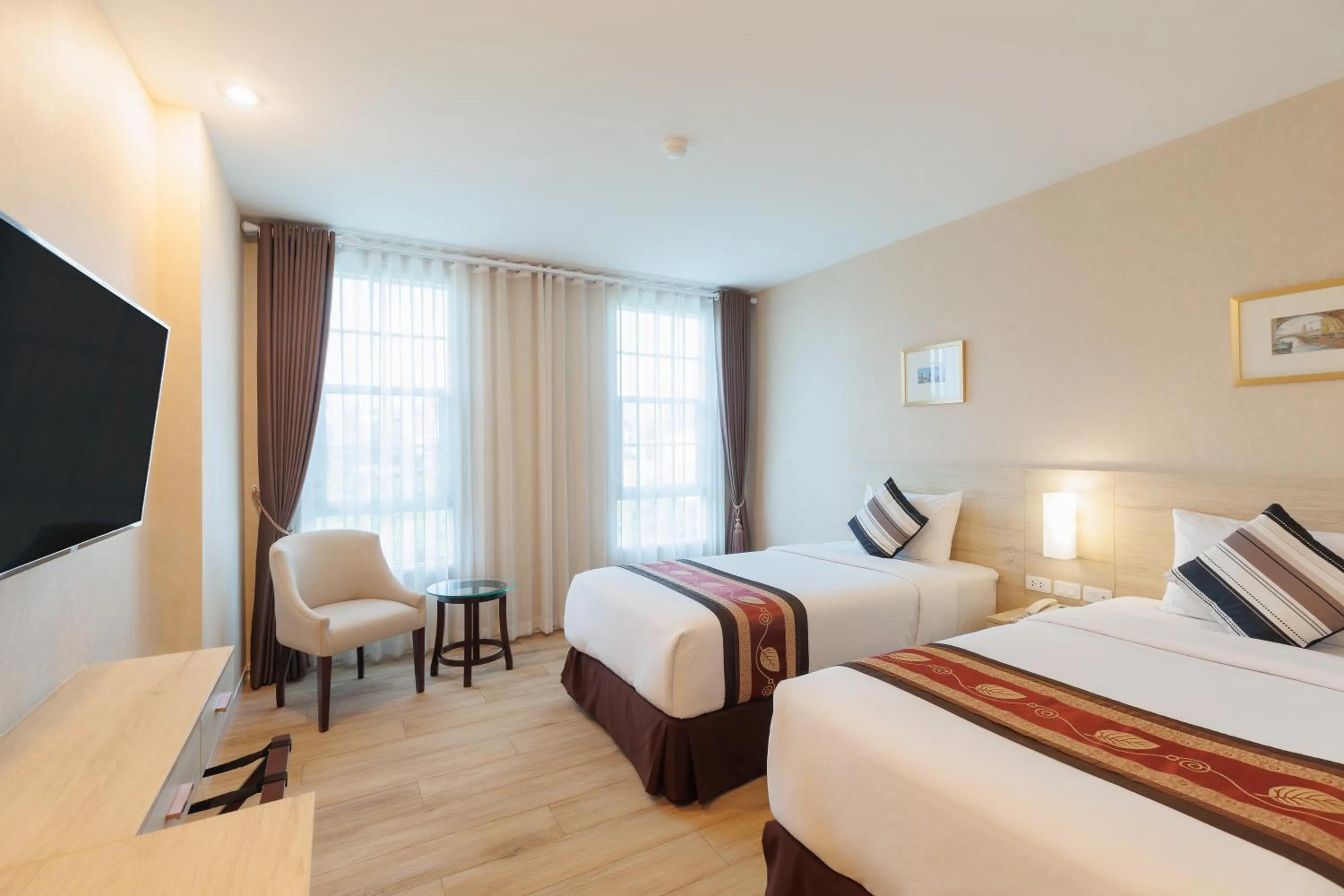 Bed in Le Cannes Hotel