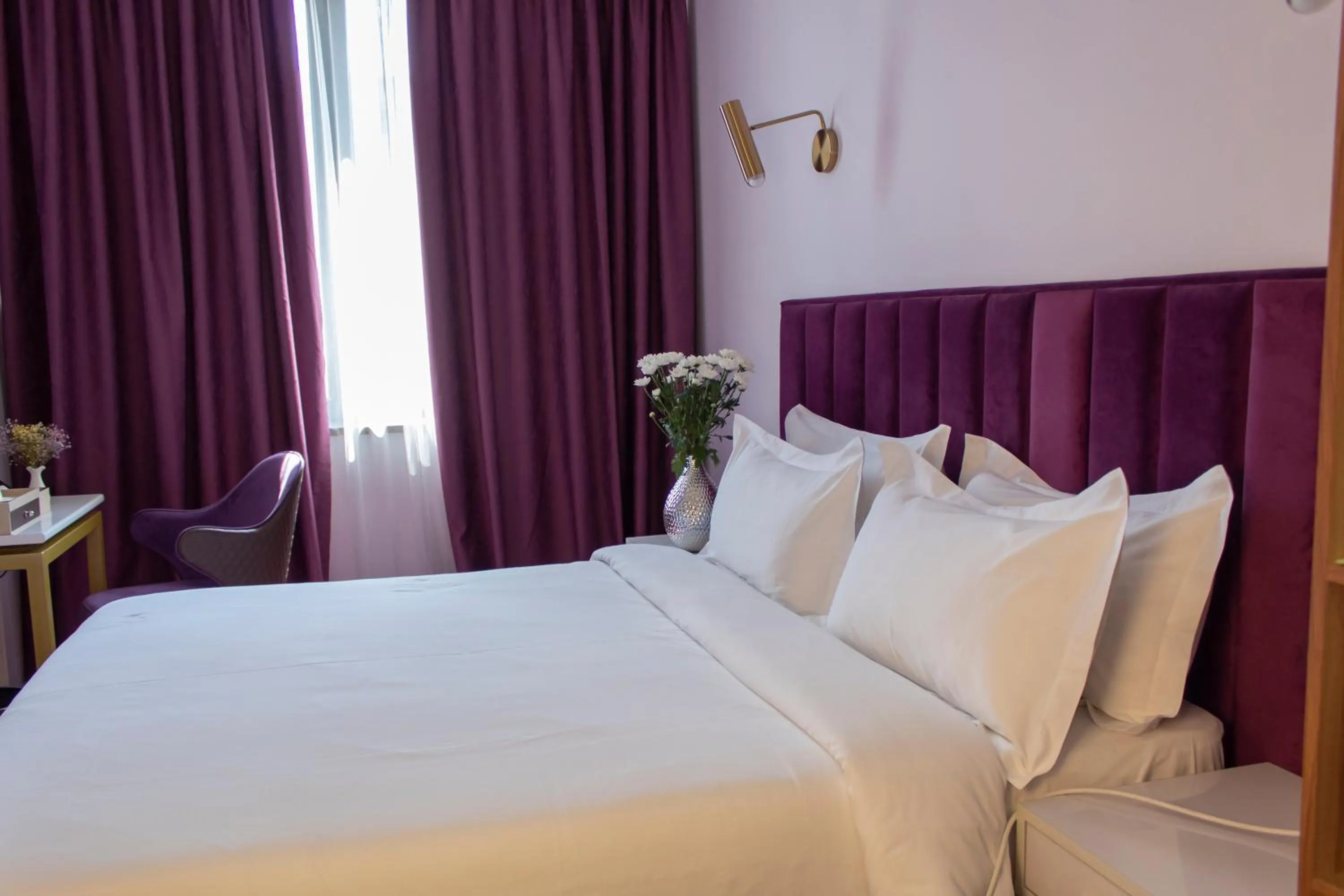 Bed in Orient Hotel Bishkek