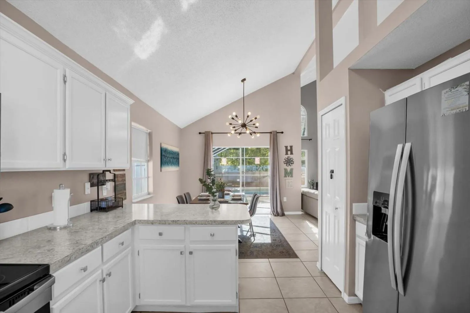 Kitchen or kitchenette in Elegant Villa Pool Fun Game Room Near Disney