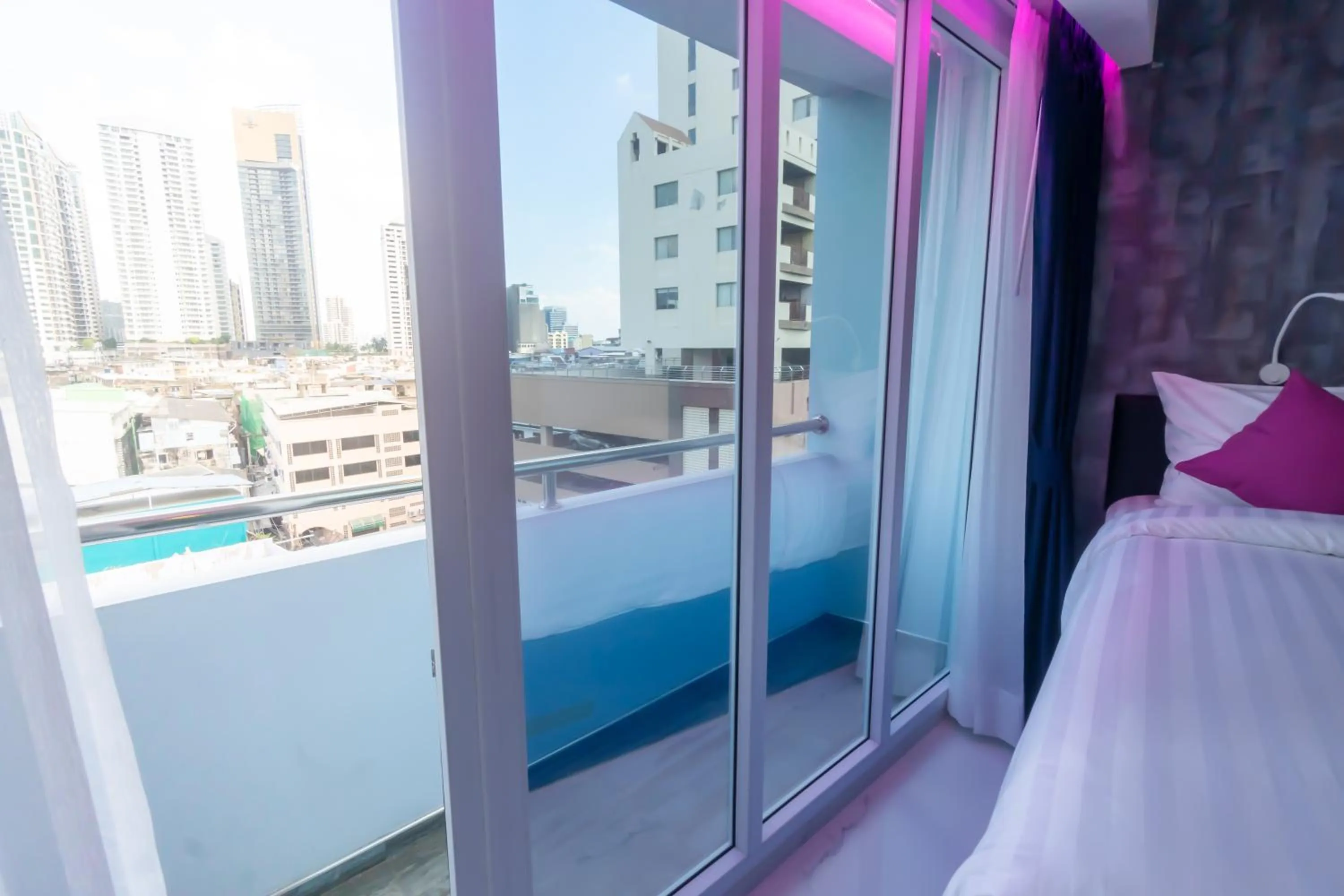 Balcony/Terrace, Bed in Spark Hotel - MRT Queen Sirikit - SHA Extra Plus Certified