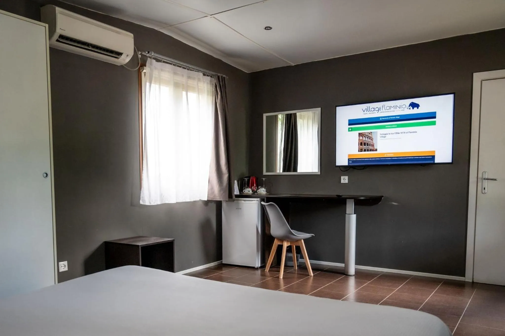 Bed in Flaminio Village Bungalow Park