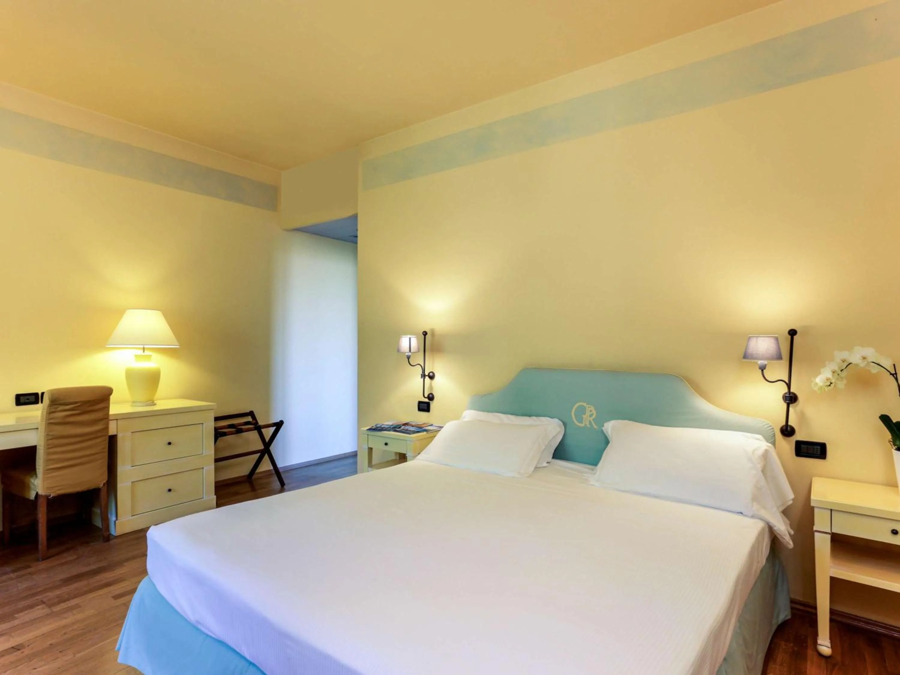 Photo of the whole room, Bed in TH Tirrenia - Green Park Resort