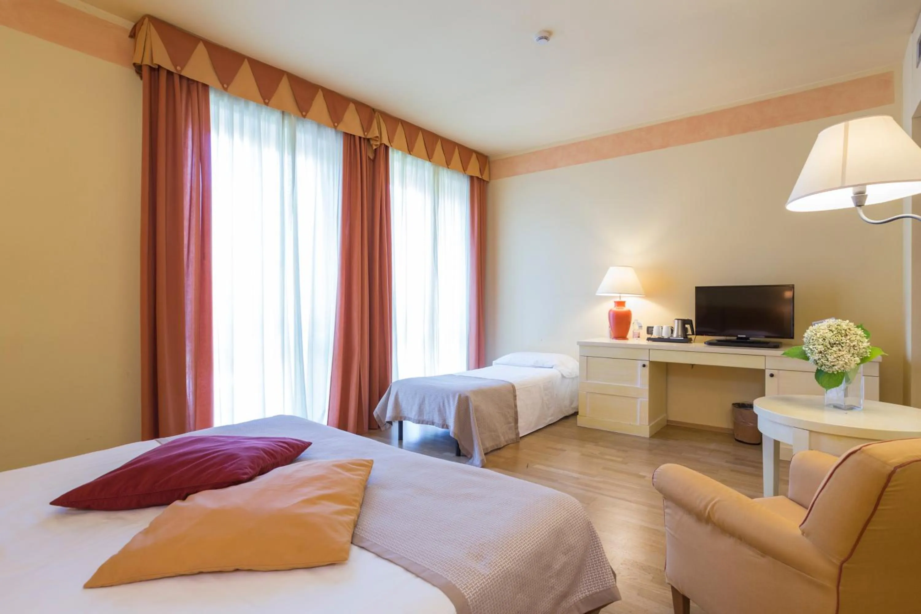 Photo of the whole room, Bed in TH Tirrenia - Green Park Resort