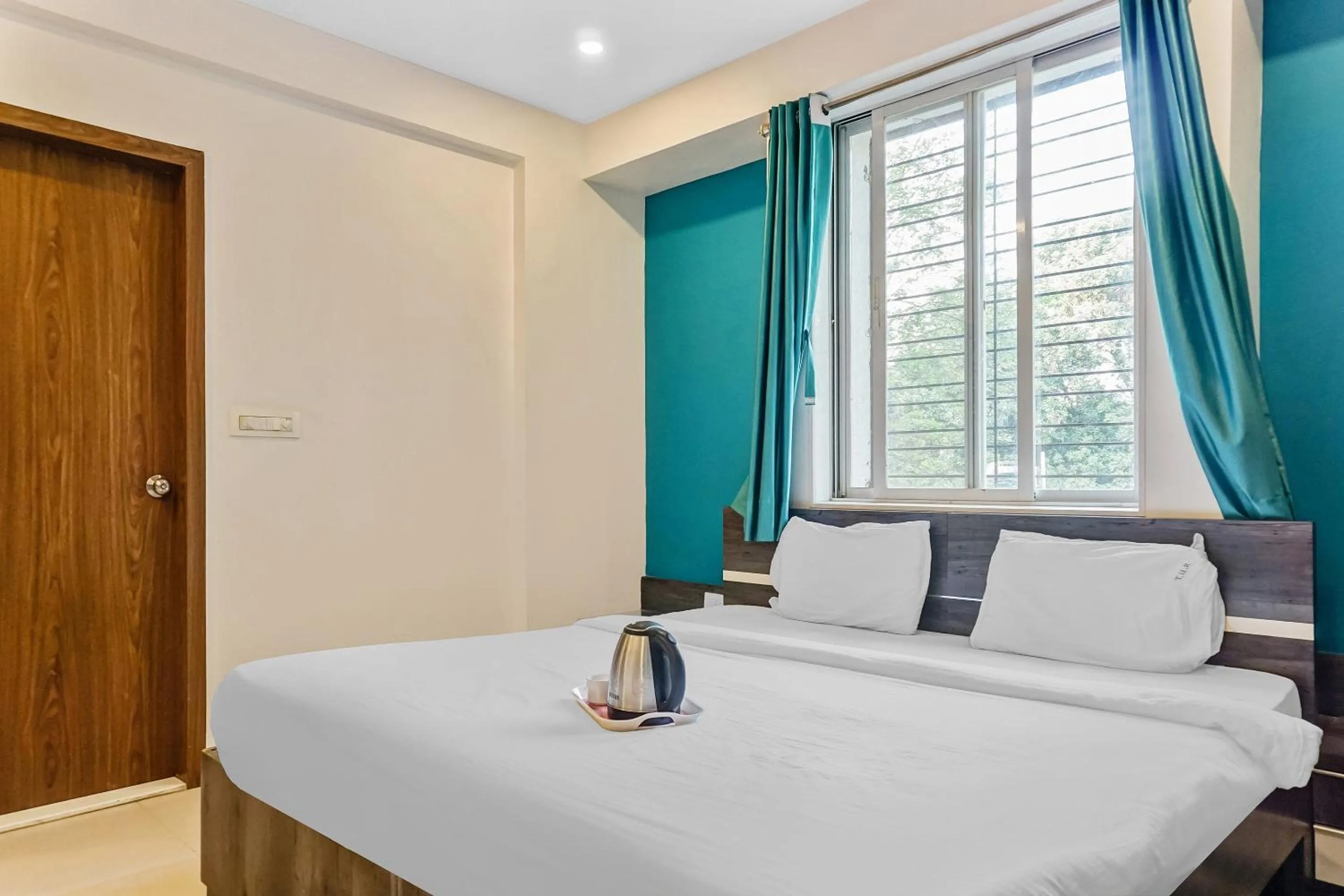 Bedroom, Bed in Super Townhouse The Upper Room Near Pune Airport