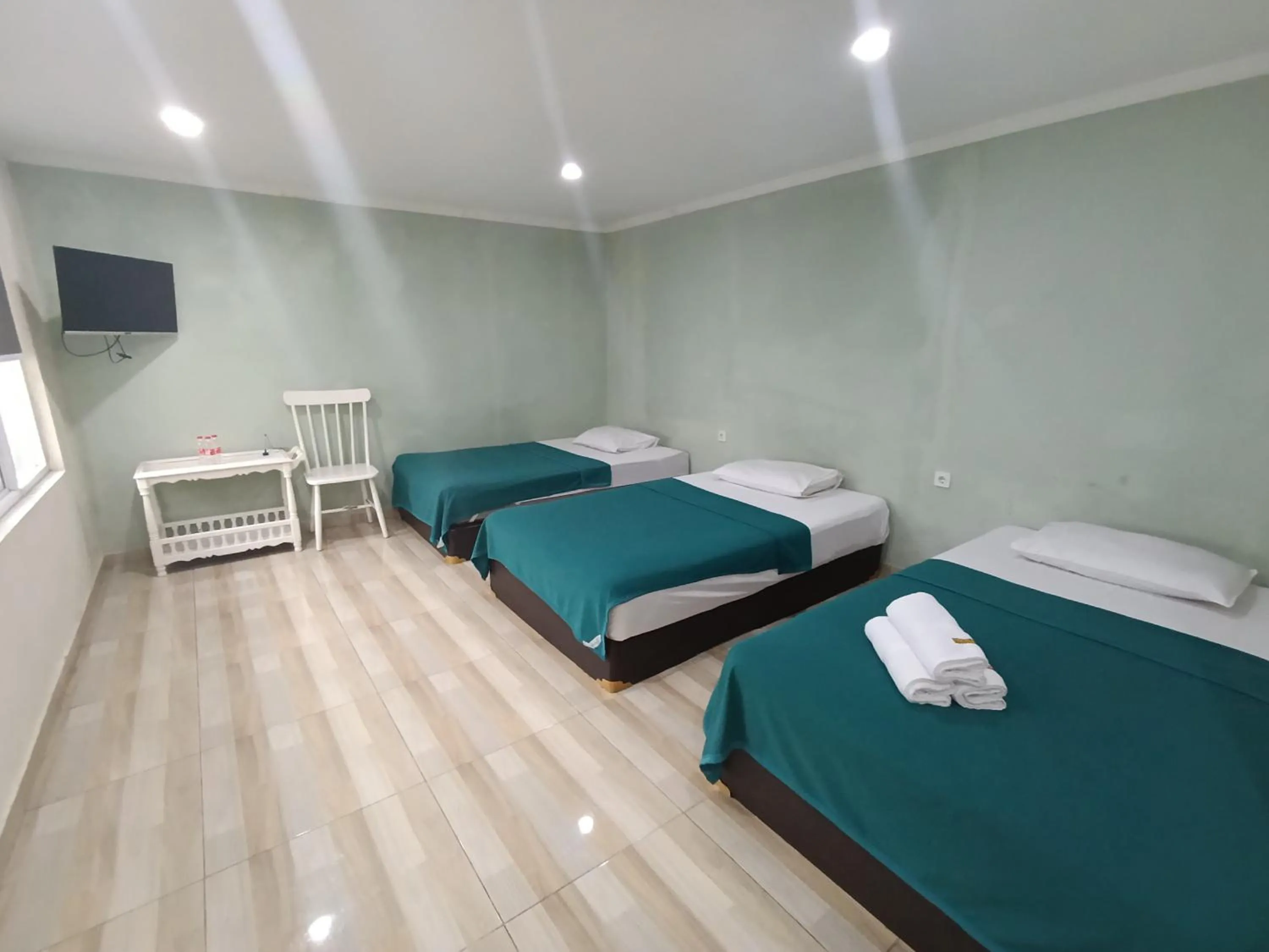 Bed in Mamifokobo Guest House