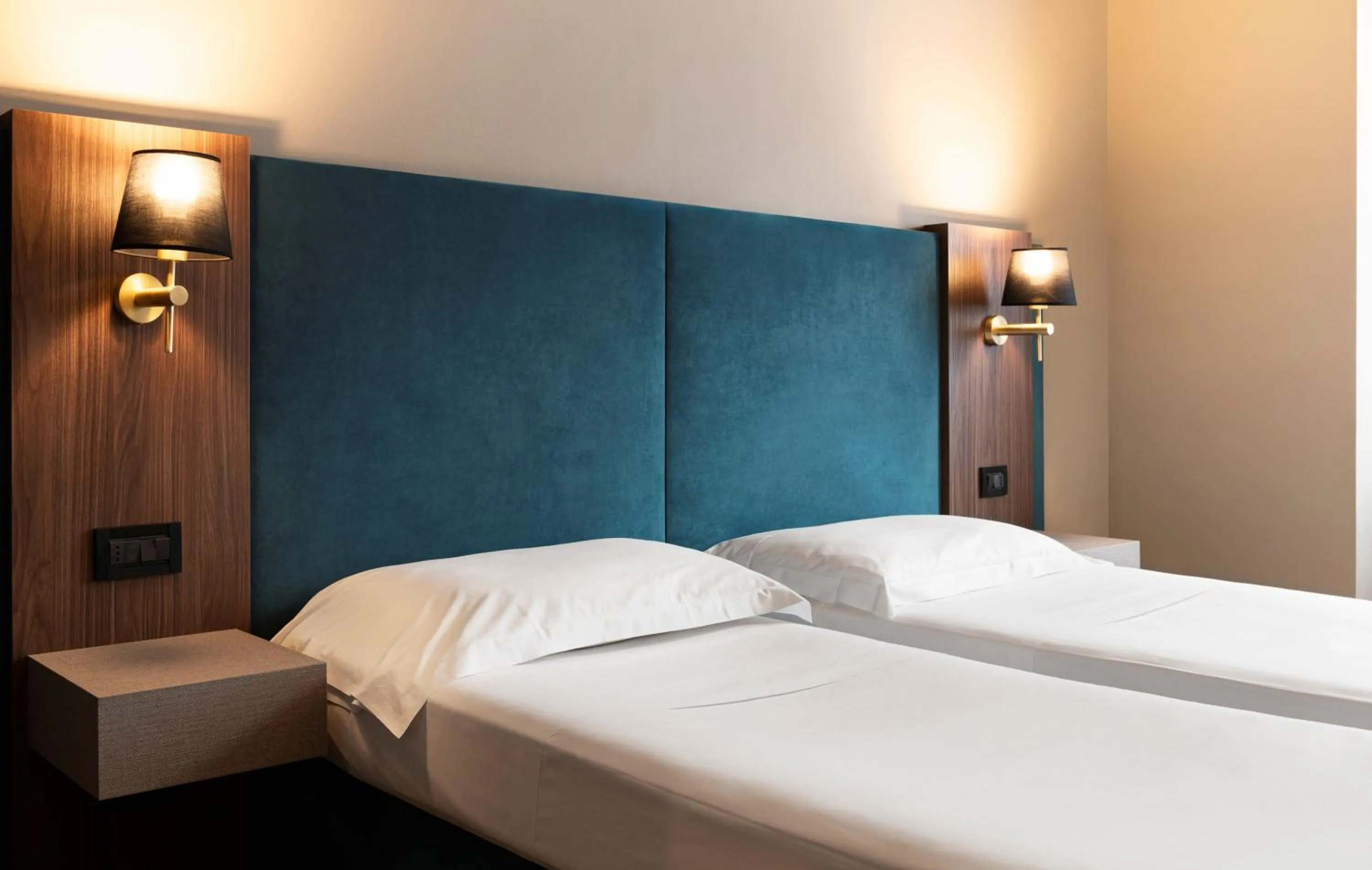 Bed in Mokinba Hotels Montebianco