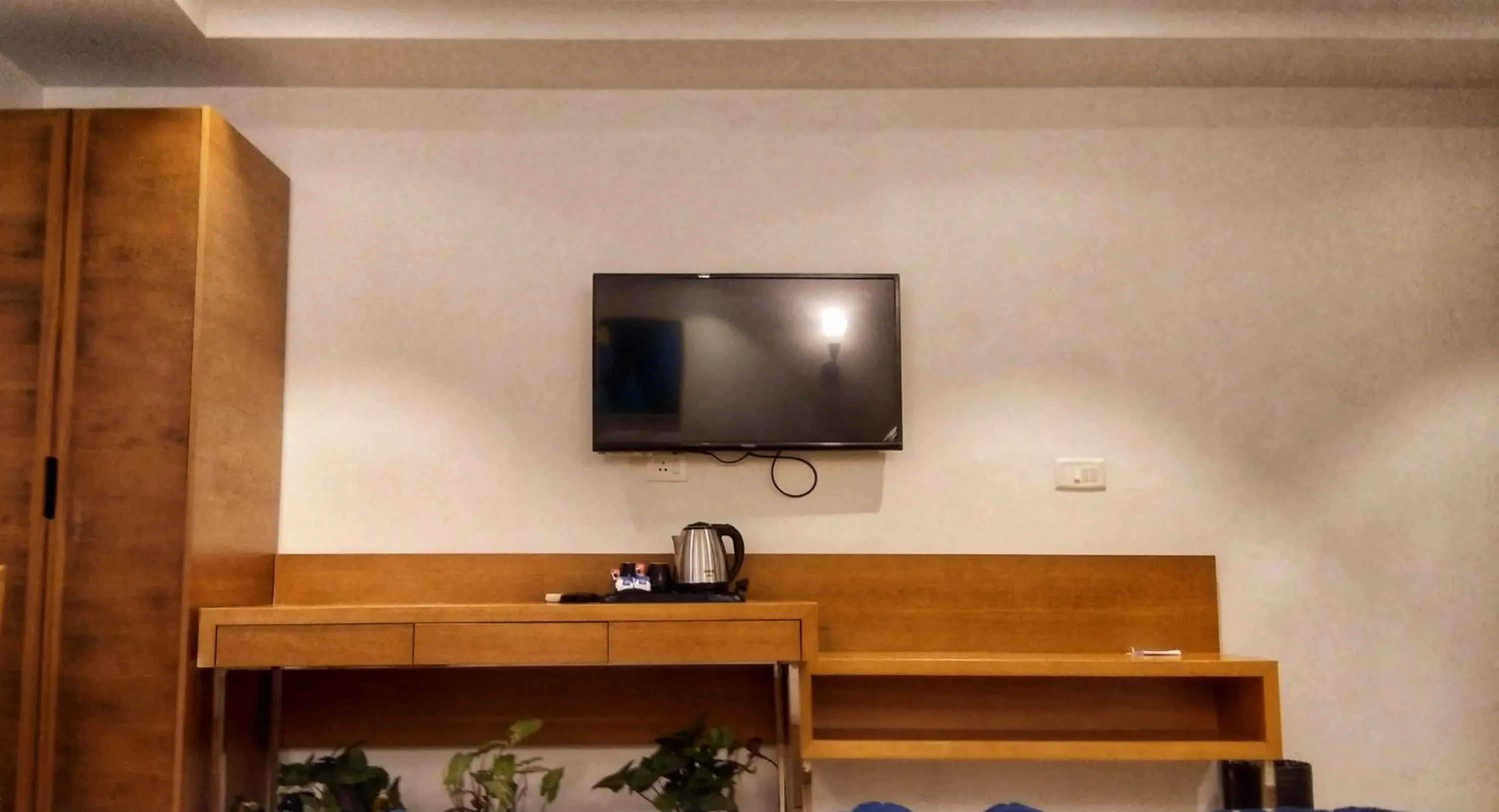 Communal lounge/ TV room in Iris Lite Corbett