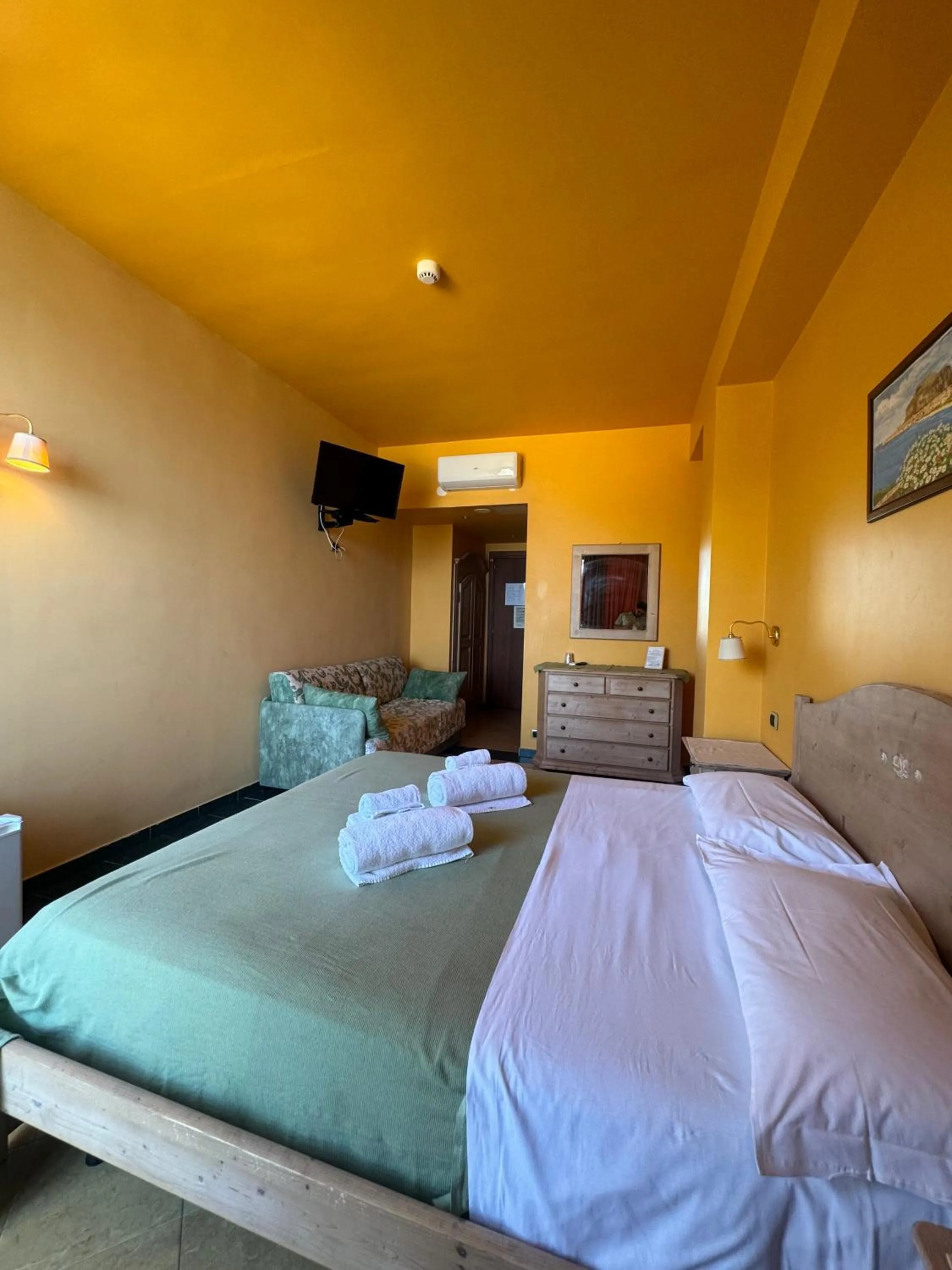 Communal lounge/ TV room, Bed in Hotel La Playa Blanca