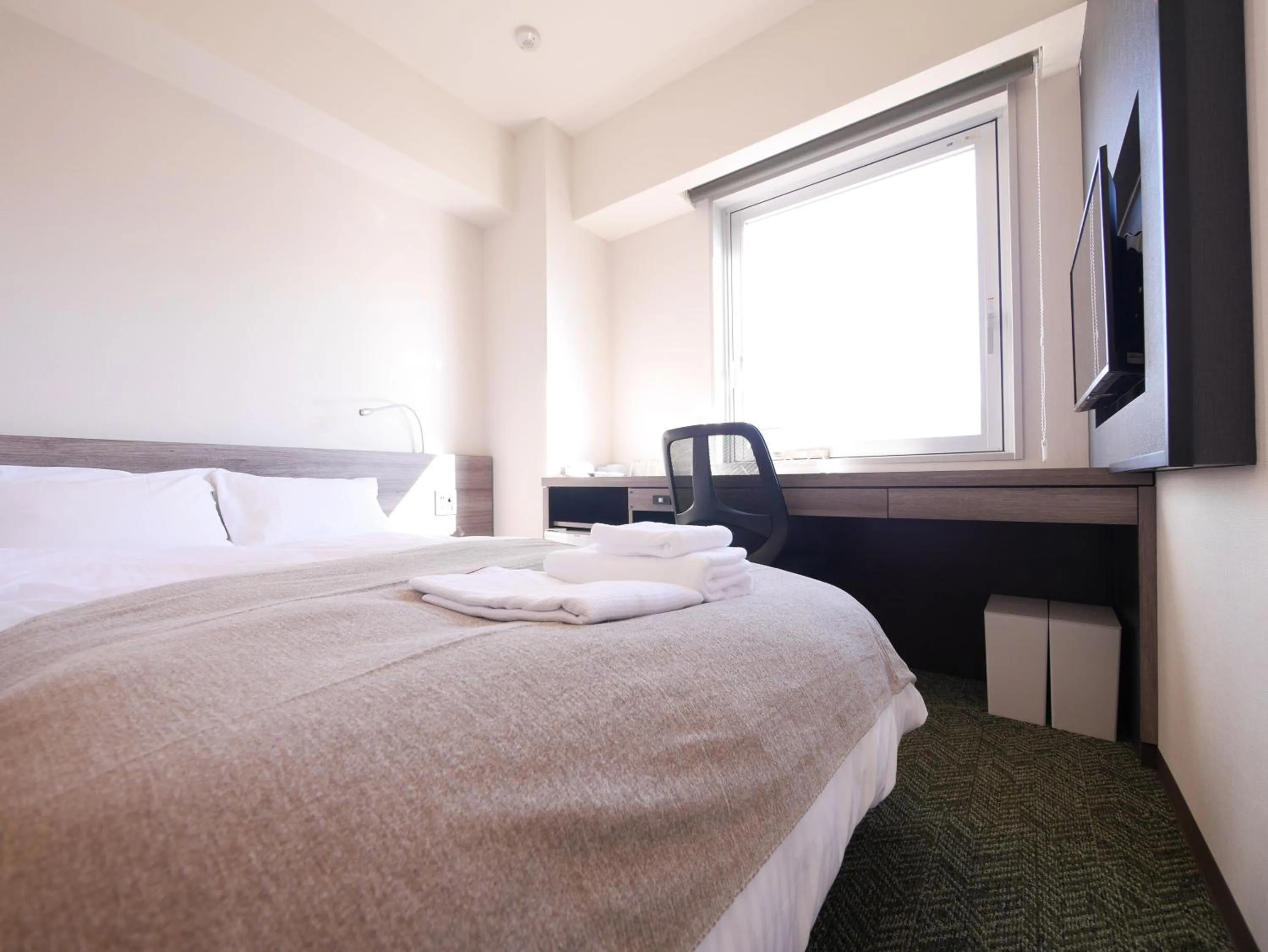 View (from property/room), Bed in Hotel Comfybed Ginza