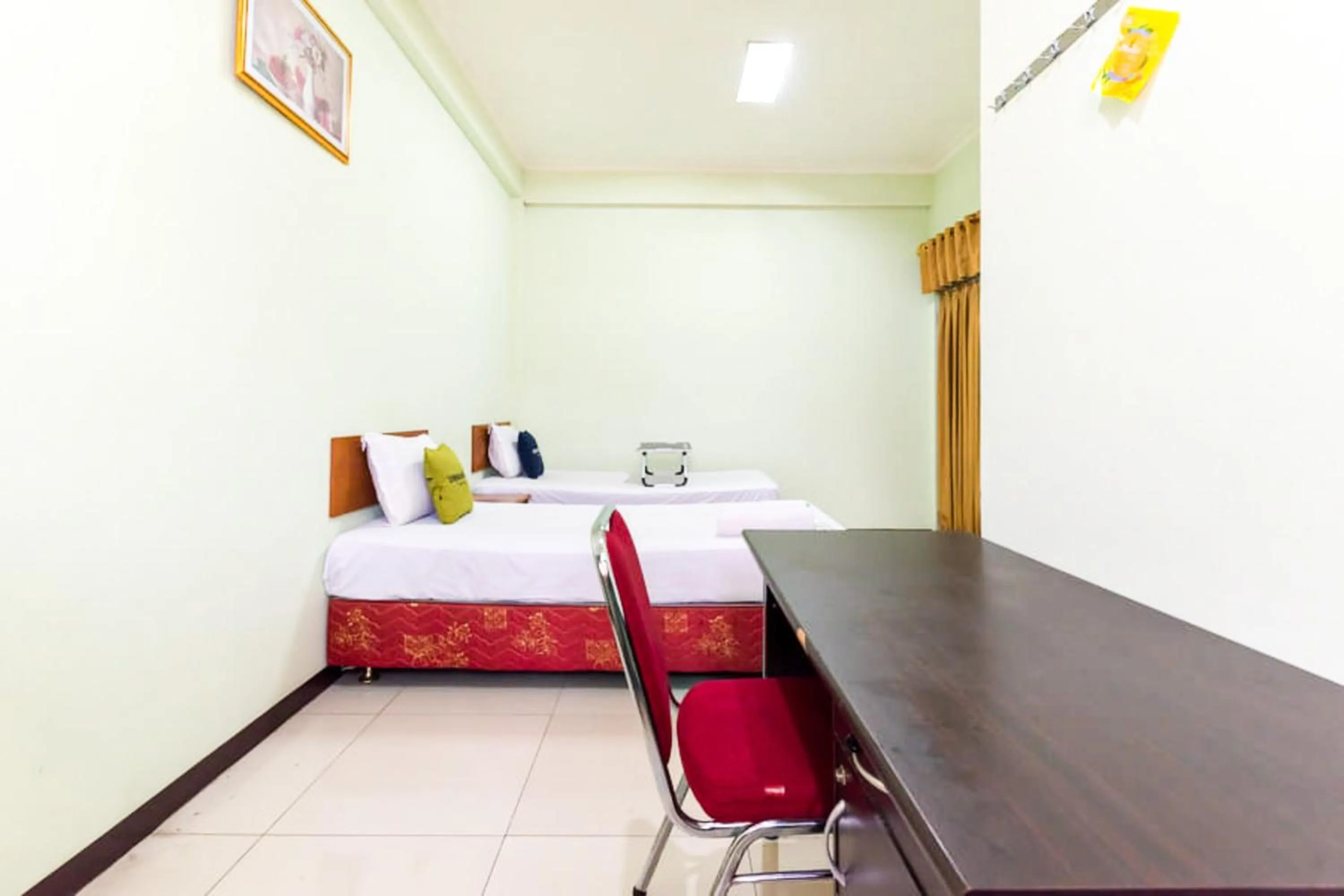 Bedroom, Bed in Urbanview Hotel Bartu Moh Toha Bandung by RedDoorz
