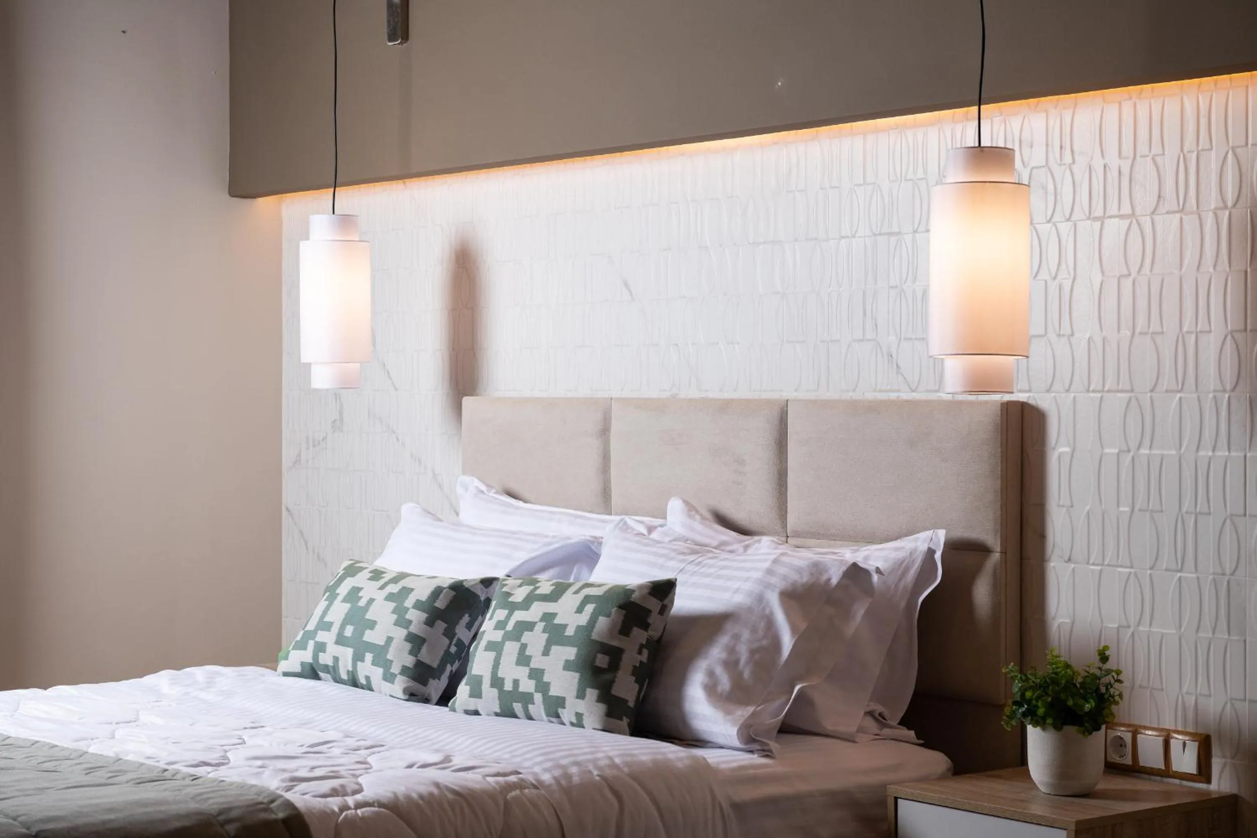 Bed in ELLE Rooms & Suites