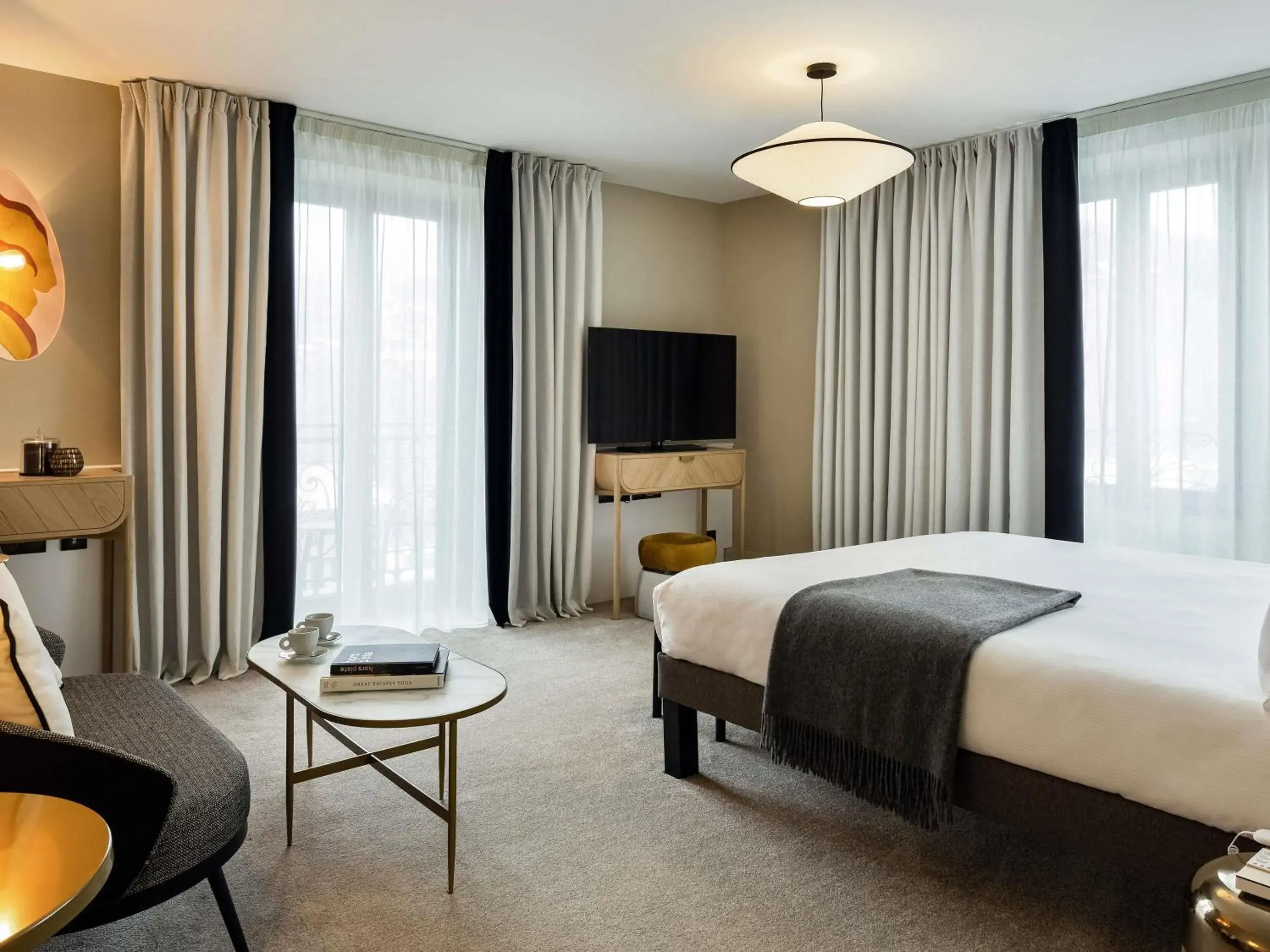 Suite with One Double and Two Twin Beds in Le Saint Gervais Hotel & Spa Handwritten Collection Suite with One Double and Two Twin Beds in Le Saint Gervais Hotel & Spa Handwritten Collection