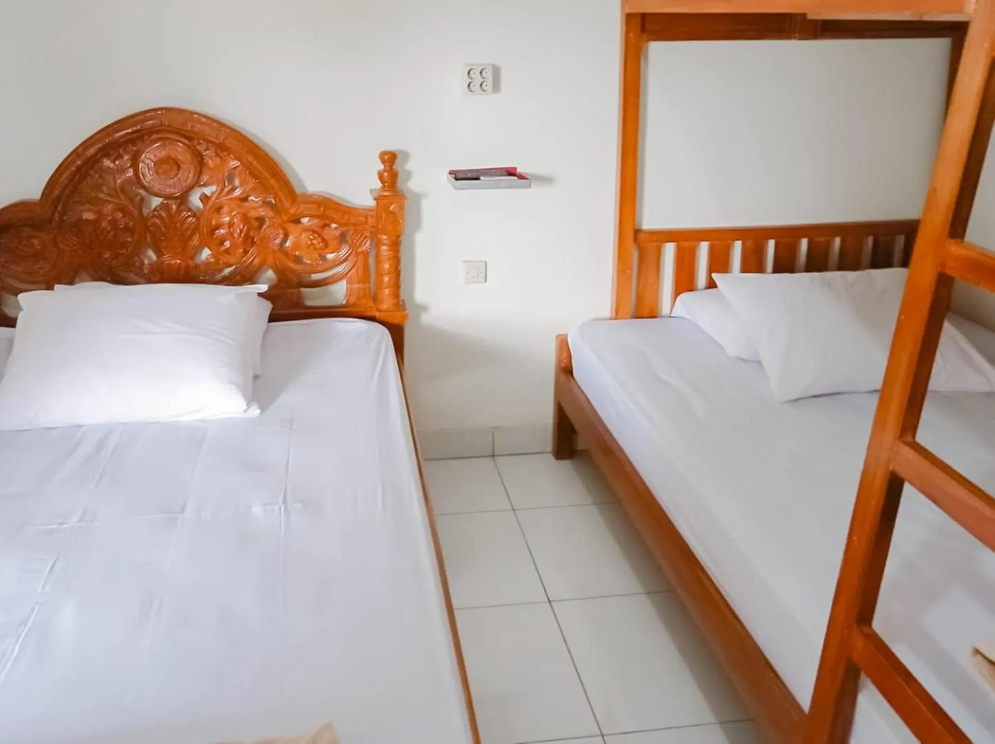 Bed in Penginapan Al Firdausi Syariah Mitra RedDoorz