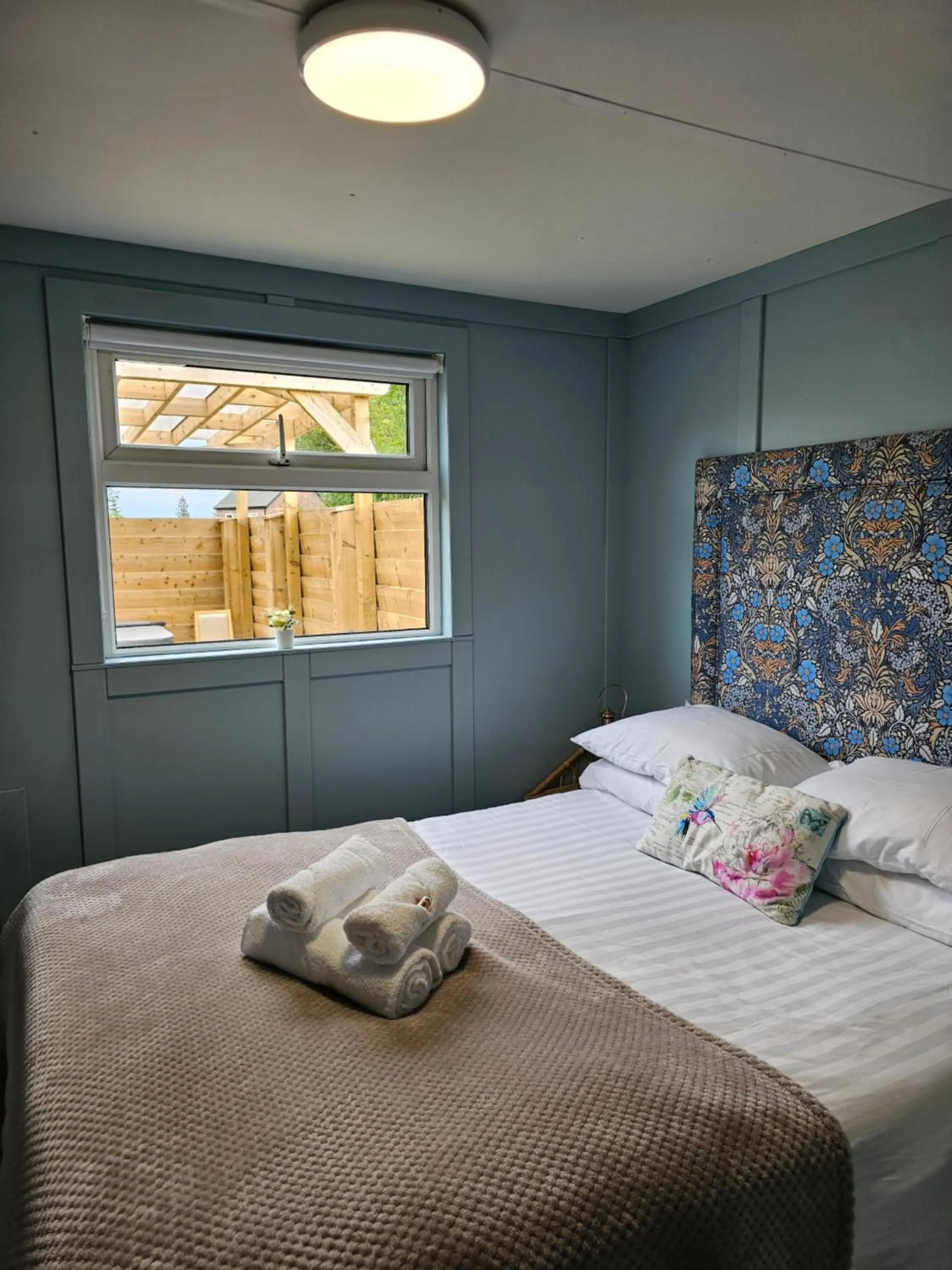 Bed in Walsh's Mill Lodges & Linen House