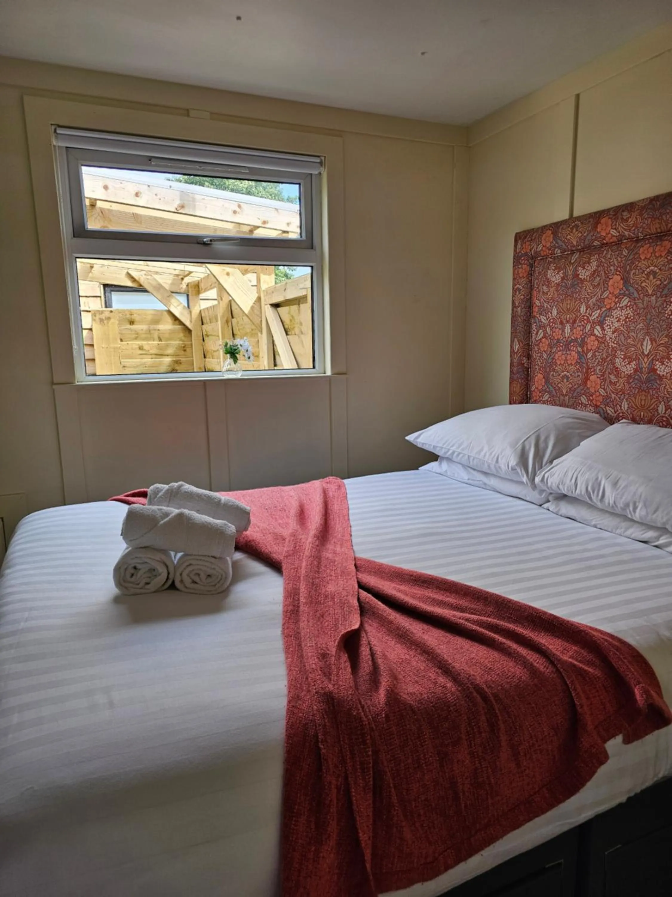 Bed in Walsh's Mill Lodges & Linen House