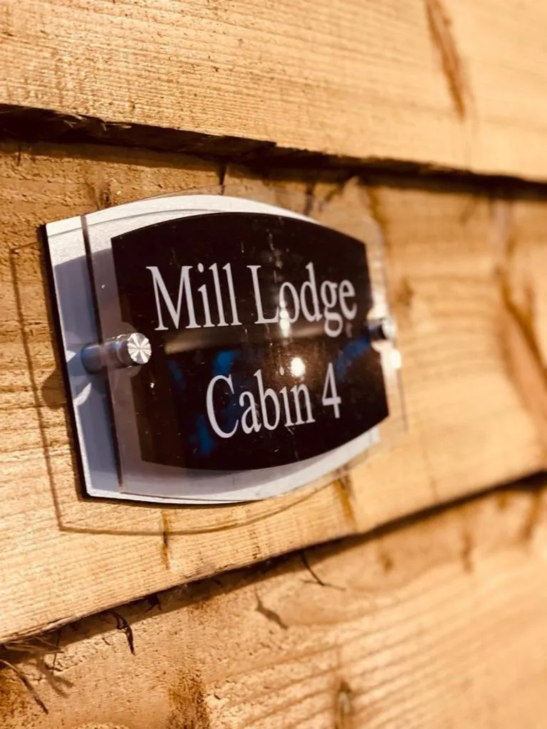 Property logo or sign in Walsh's Mill Lodges & Linen House