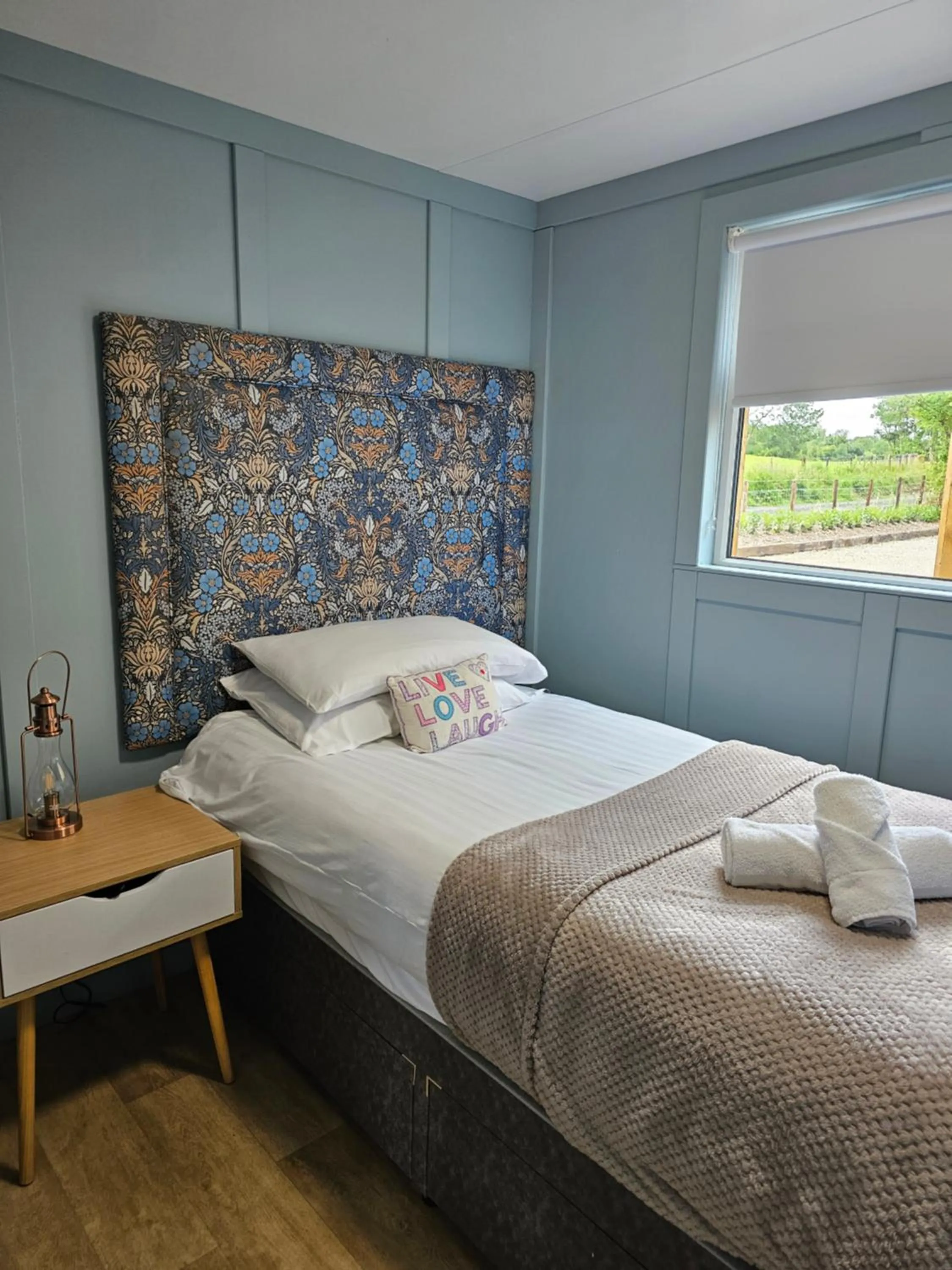 Bed in Walsh's Mill Lodges & Linen House